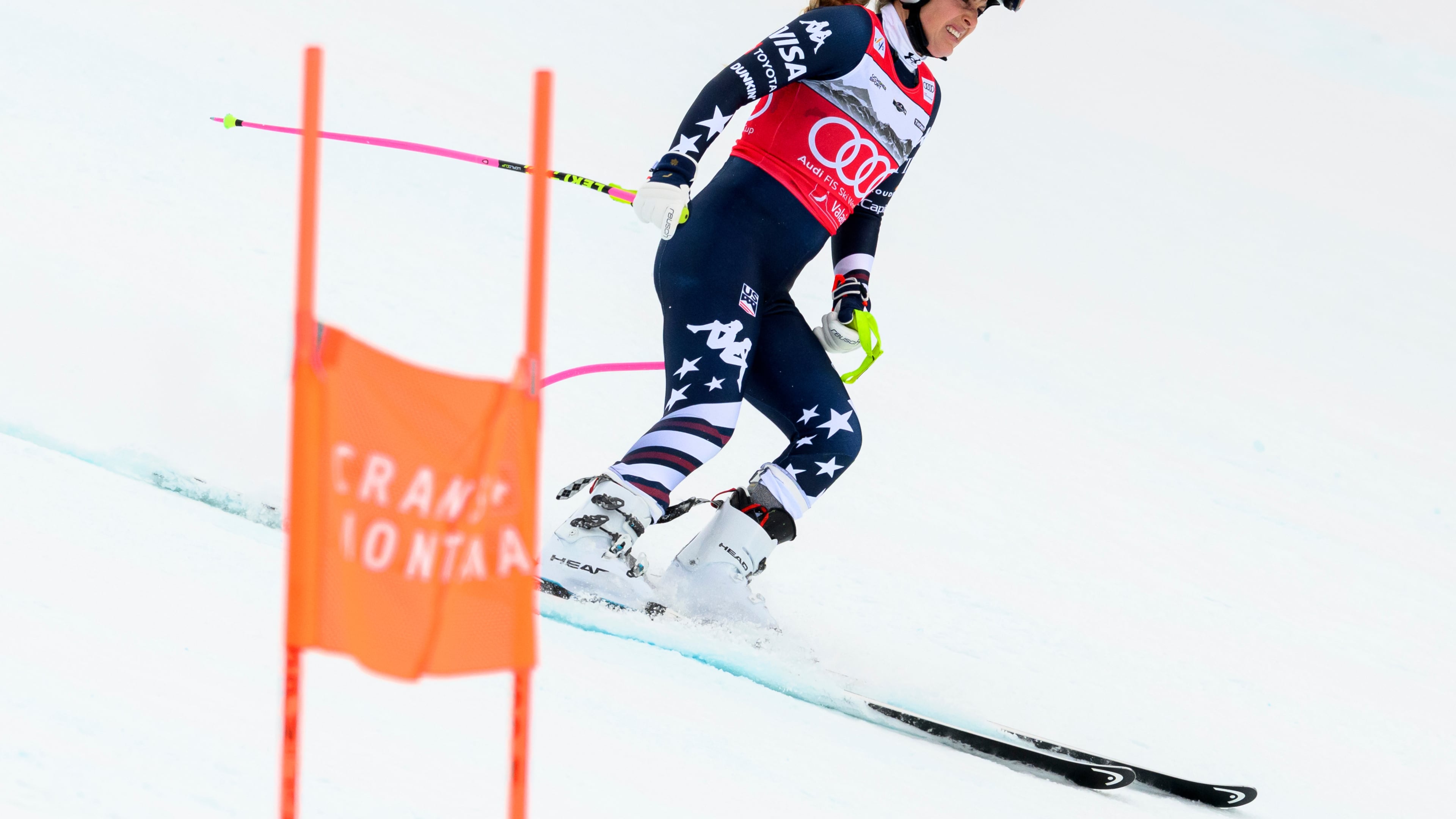 United States' Lindsey Vonn grimaces as she approaches the finish area after crashing, during an alpine ski, women’s World Cup downhill, in Crans Montana, Switzerland, Friday, Jan. 30, 2026. (Jean-Christophe Bott/Keystone via AP)