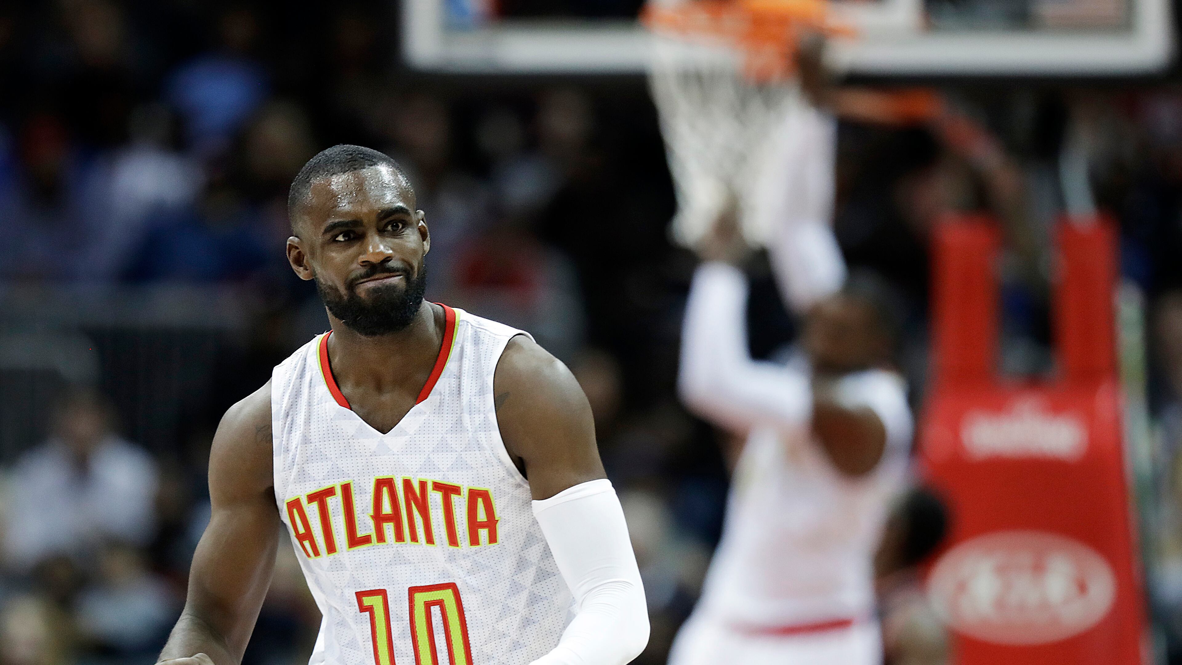 Atlanta Hawks’ Tim Hardaway Jr., left, celebrates after assisting teammate Paul Millsap, rear, for the dunk in the third quarter of an NBA basketball game against the Toronto Raptors in Atlanta, Friday, March 10, 2017. Atlanta won 105-99. (AP Photo/David Goldman)