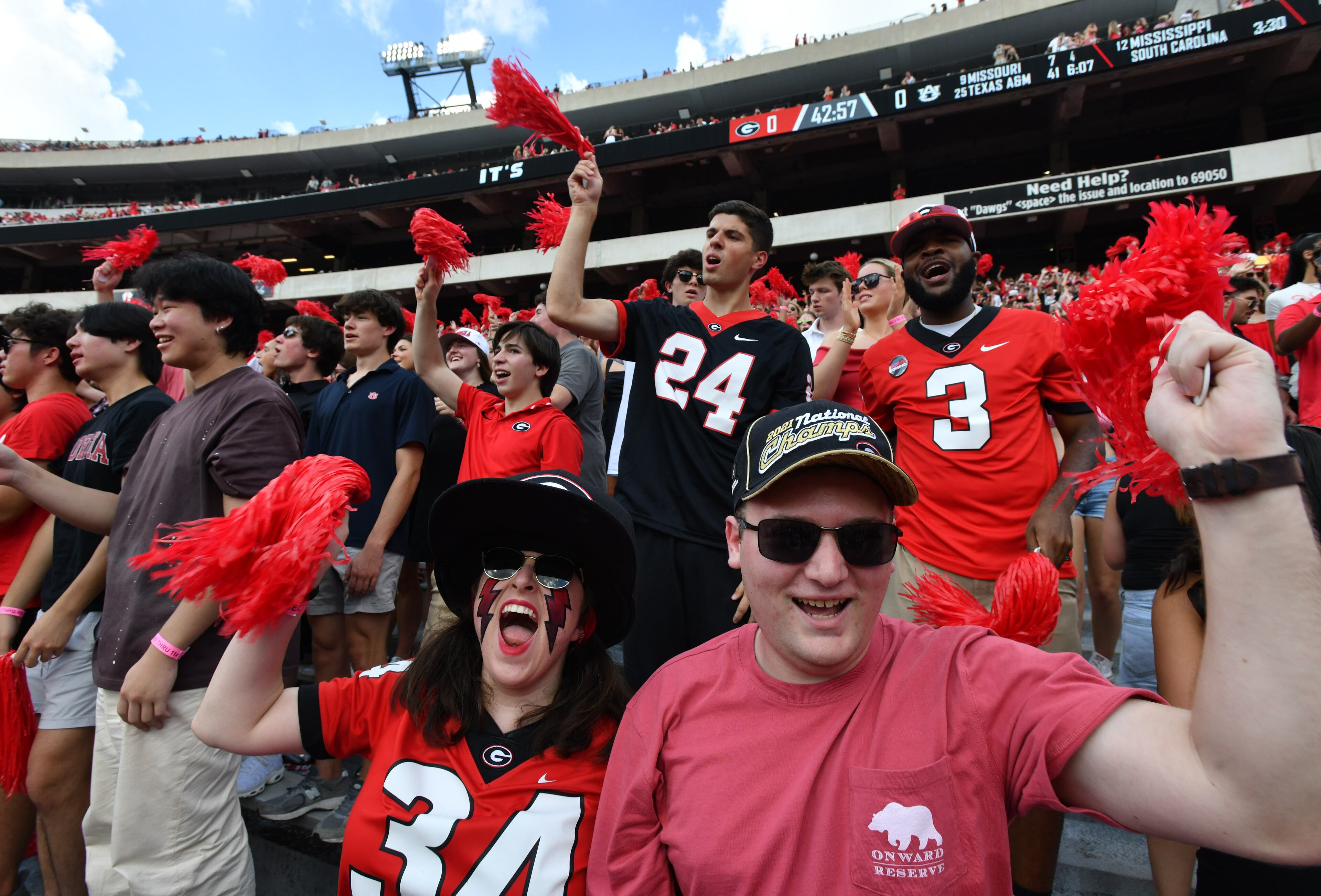 Georgia fans cheer before an NCAA football game between Georgia and Auburn at Sanford Stadium, Saturday, October 5, 2024, in Athens. (Hyosub Shin / AJC)