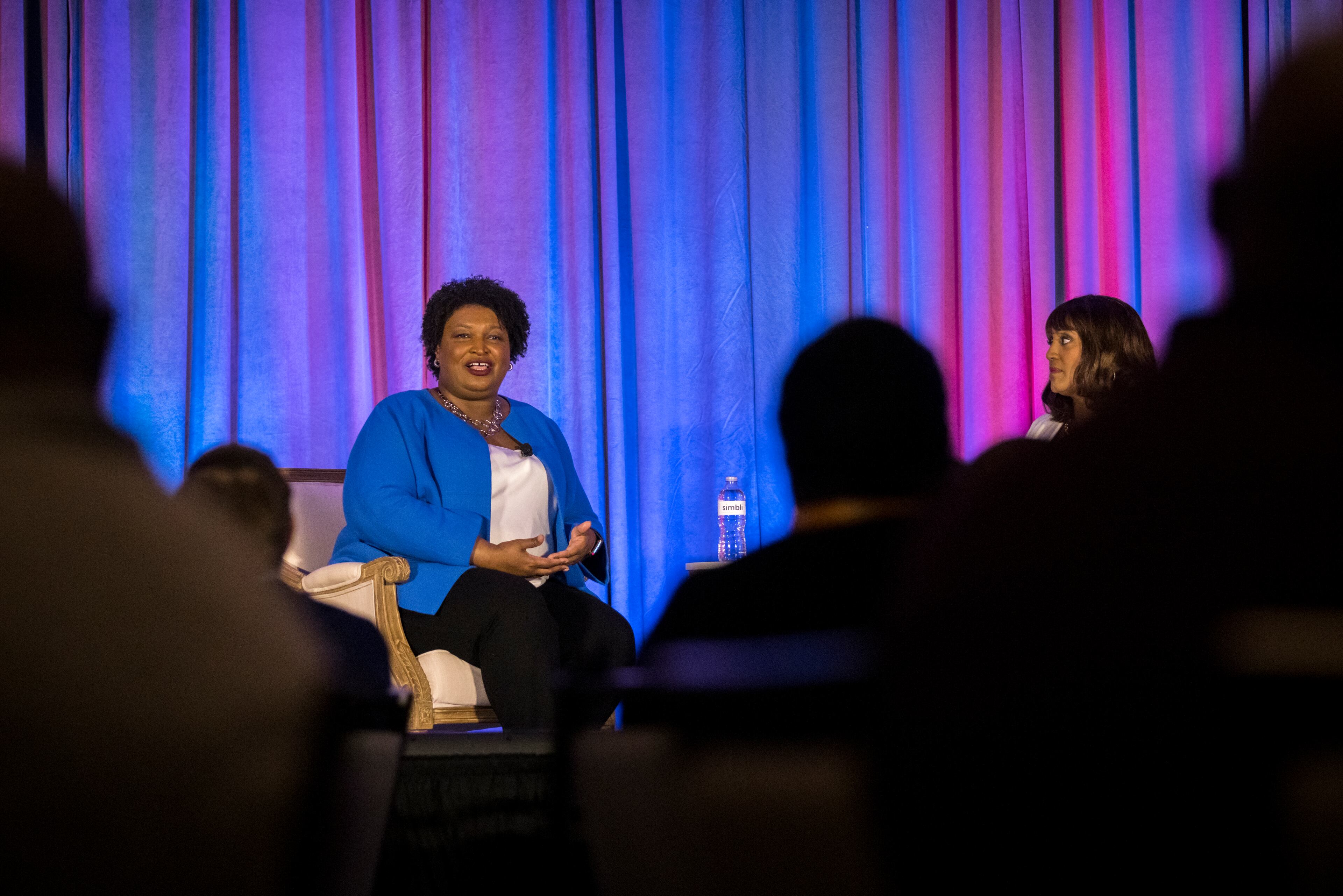 SAVANNAH, GEORGIA - JUNE 11, 2022: Gubernatorial candidate Stacey Abrams, right, speaks during the Georgia School Board Association Summer conference in Savannah. (Stephen B. Morton for The Atlanta Journal-Constitution).