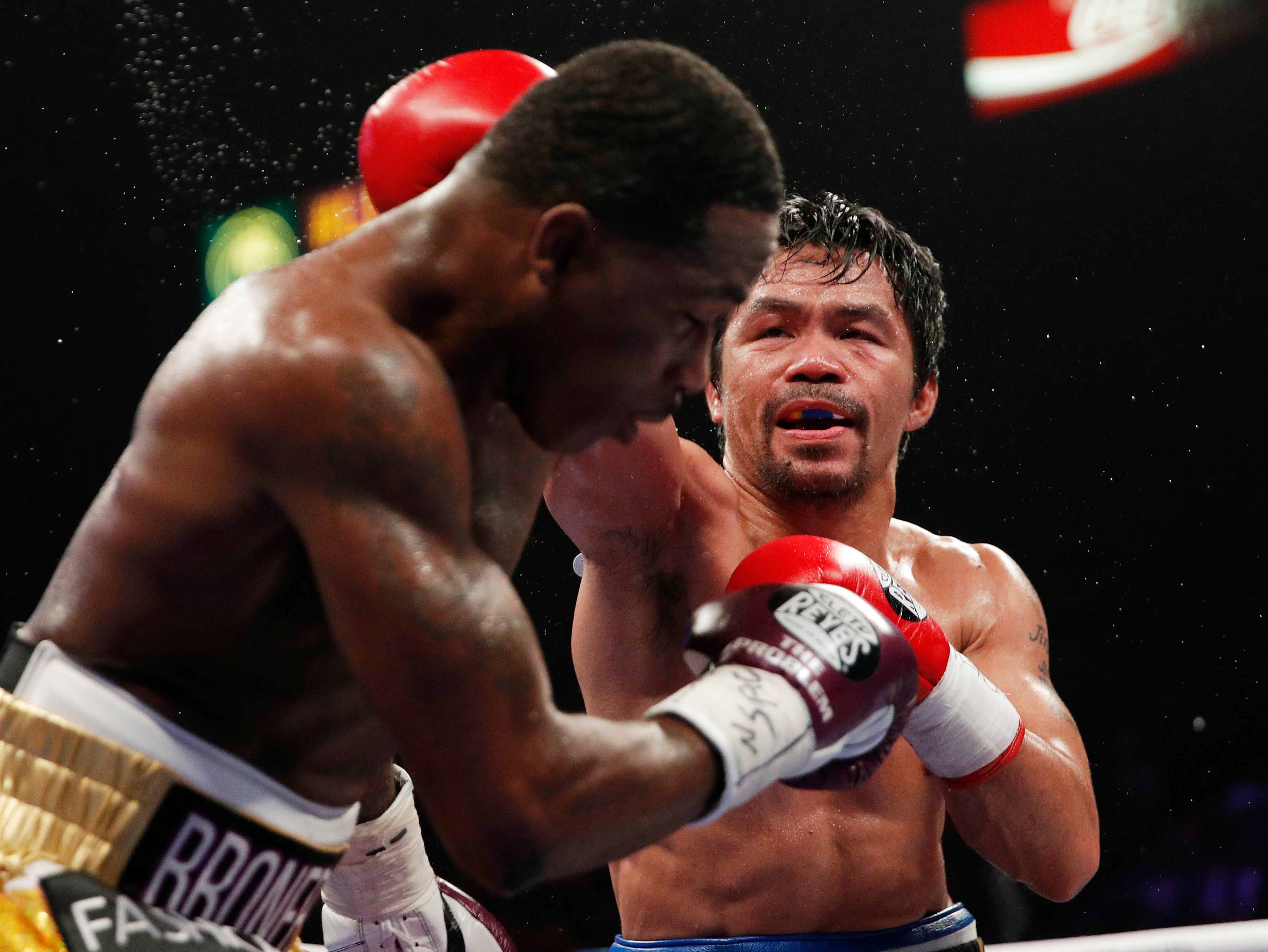 Manny Pacquiao, right, hits Adrien Broner during a WBA welterweight title boxing match Saturday, Jan. 19, 2019, in Las Vegas. (AP Photo/John Locher)
