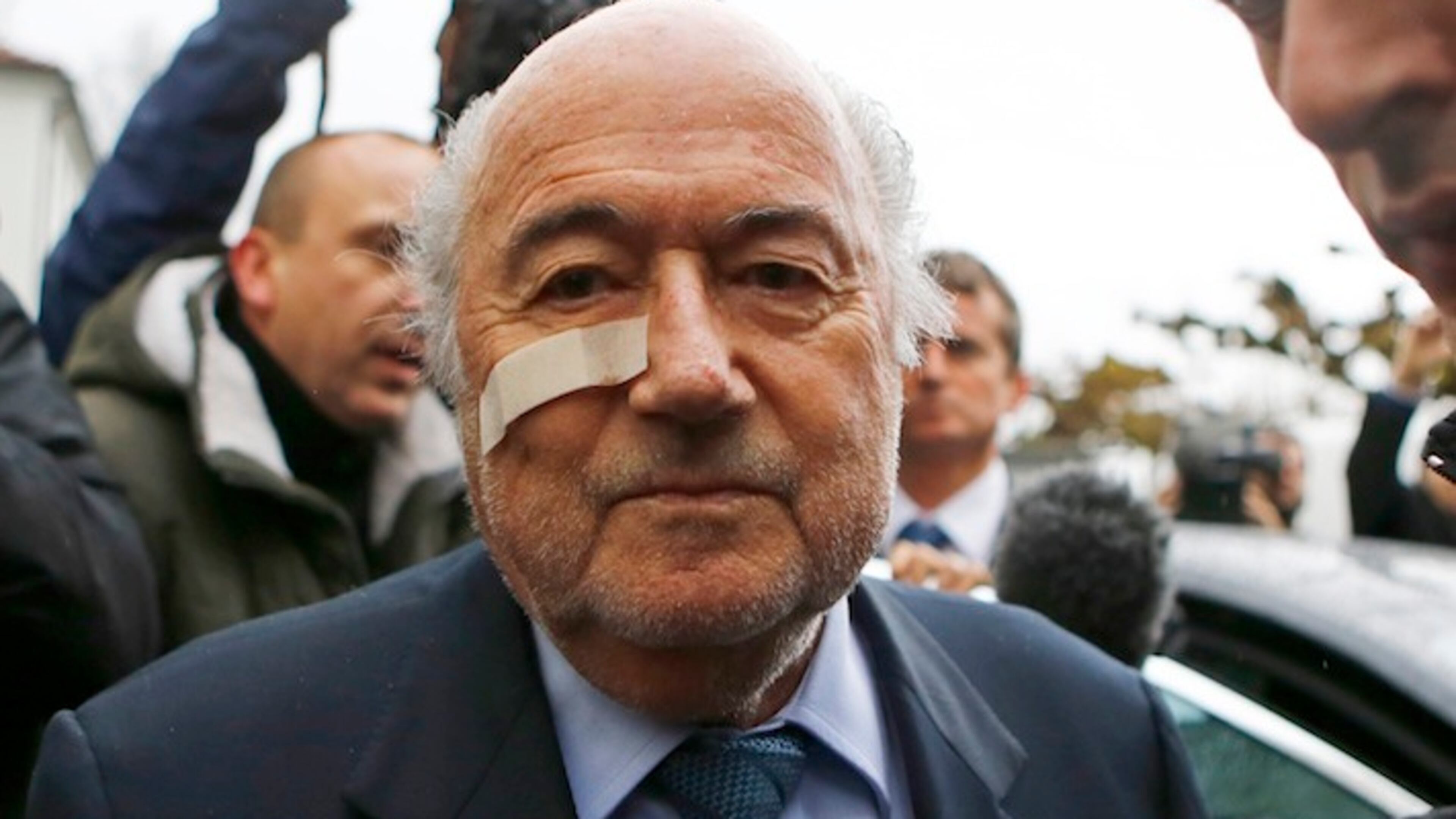 FILE - In this Dec. 21, 2015 file photo, FIFA President Sepp Blatter arrives for a news conference in Zurich, Switzerland, after he was banned for 8 years from all football-related activities over a $2 million payment by FIFA to Michel Platini, the president of European soccer's ruling body UEFA. 2015 was the year when scandals off the field of play eclipsed exploits on it. (AP Photo/Matthias Schrader, File)