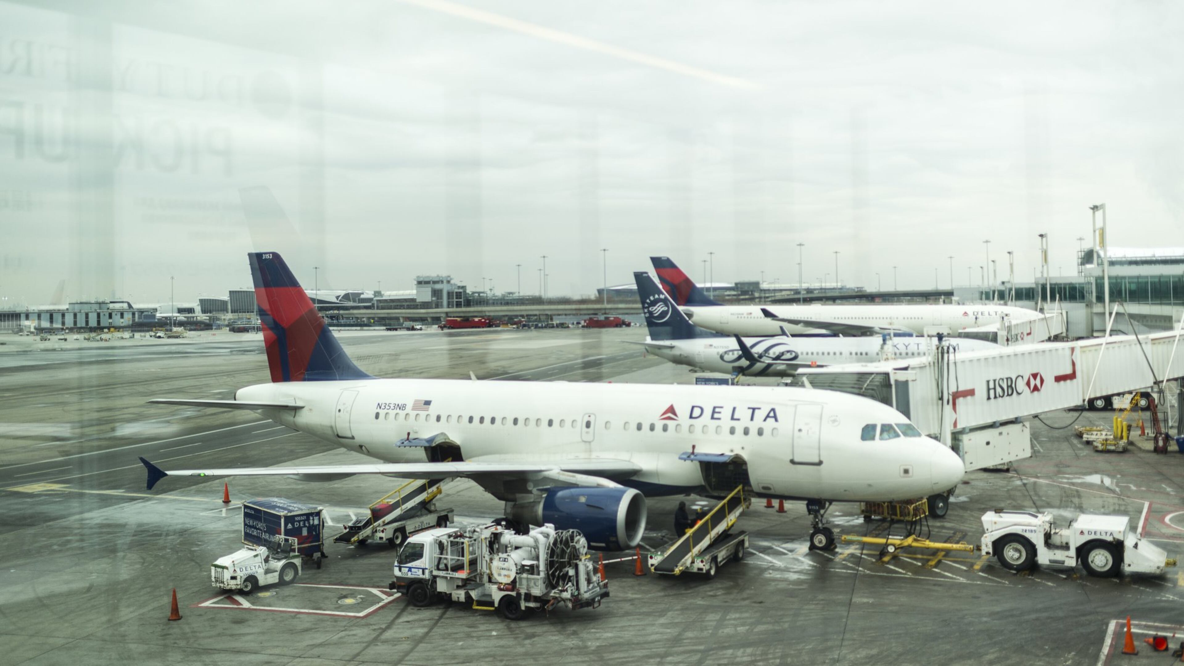 Planes at Delta Air Lines gates at John F. Kennedy International Airport in New York, in 2016. Starting in 2018, the government will begin counting flights operated by the big airlines’ regional partners - flights more prone to delays. (Daniel Krieger/The New York Times File Photo)