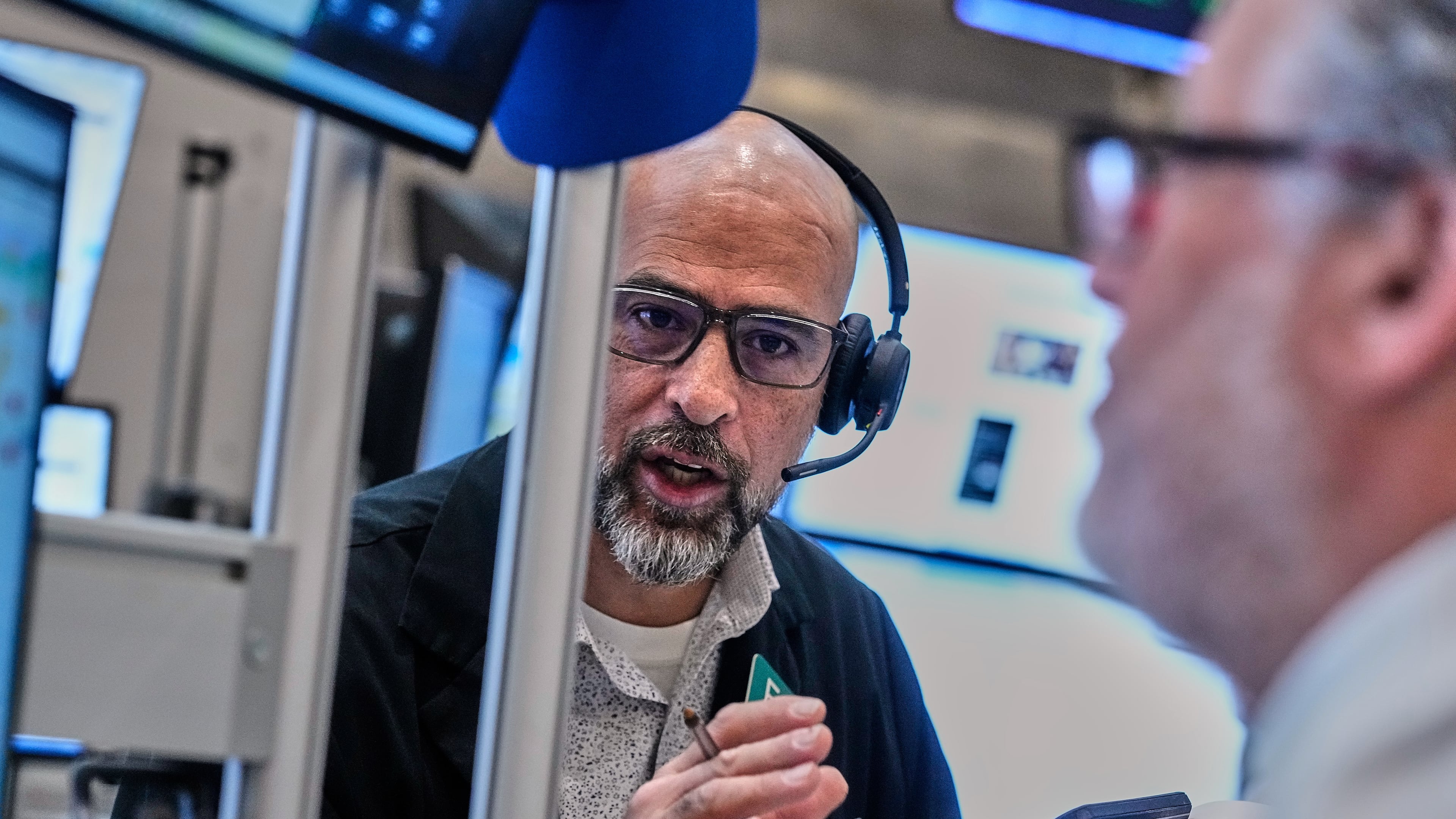 Options traders Steven Rodriguez, left, and Marty Handler work on the floor of the New York Stock Exchange, Wednesday, June 3, 2026. (AP Photo/Richard Drew)