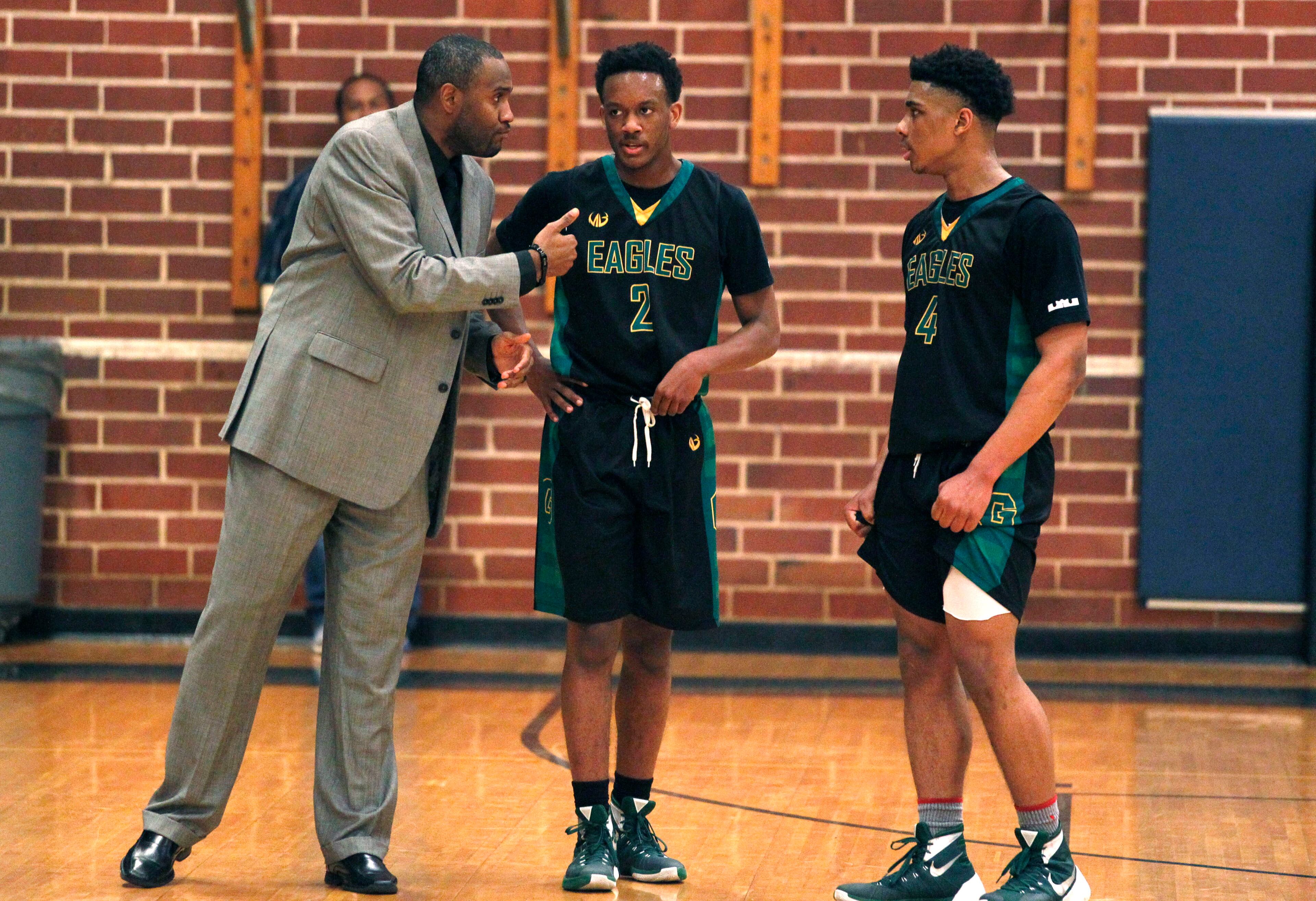 Greenforest Christian head coach Larry Thompson (L) talks to Janden Duggan (2) and Justin Forrest (4) during their game against Landmark Christian at a high school basketball game at Landmark Christian school Friday, February 5, 2016. TAMI CHAPPELL/SPECIAL TO THE AJC
