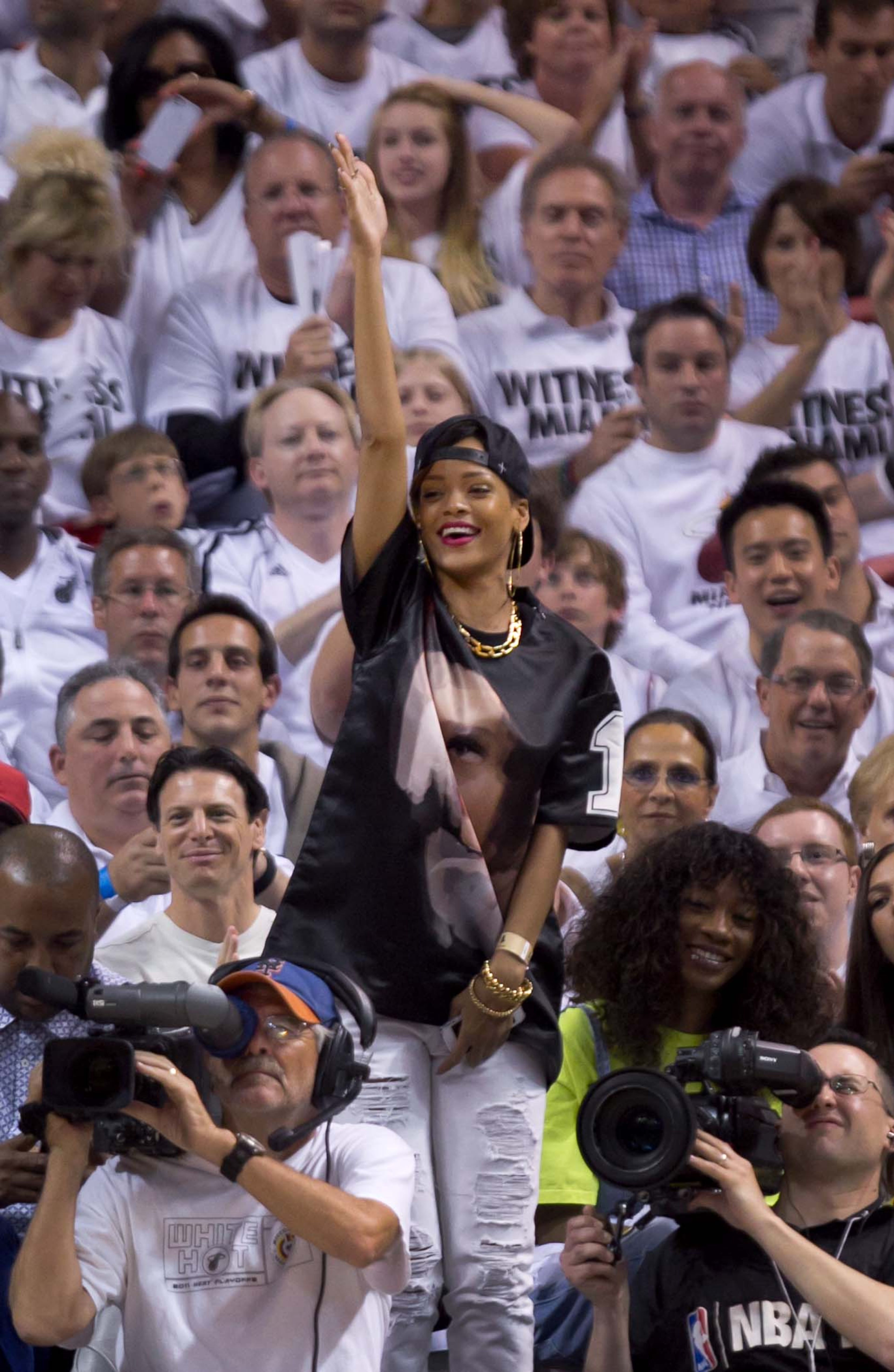 Singer/actress Rihanna cheers during the Miami Heat first round playoff win over the Bucks AmericanAirlines Arena on April 21, 2013. (Allen Eyestone/The Palm Beach Post)