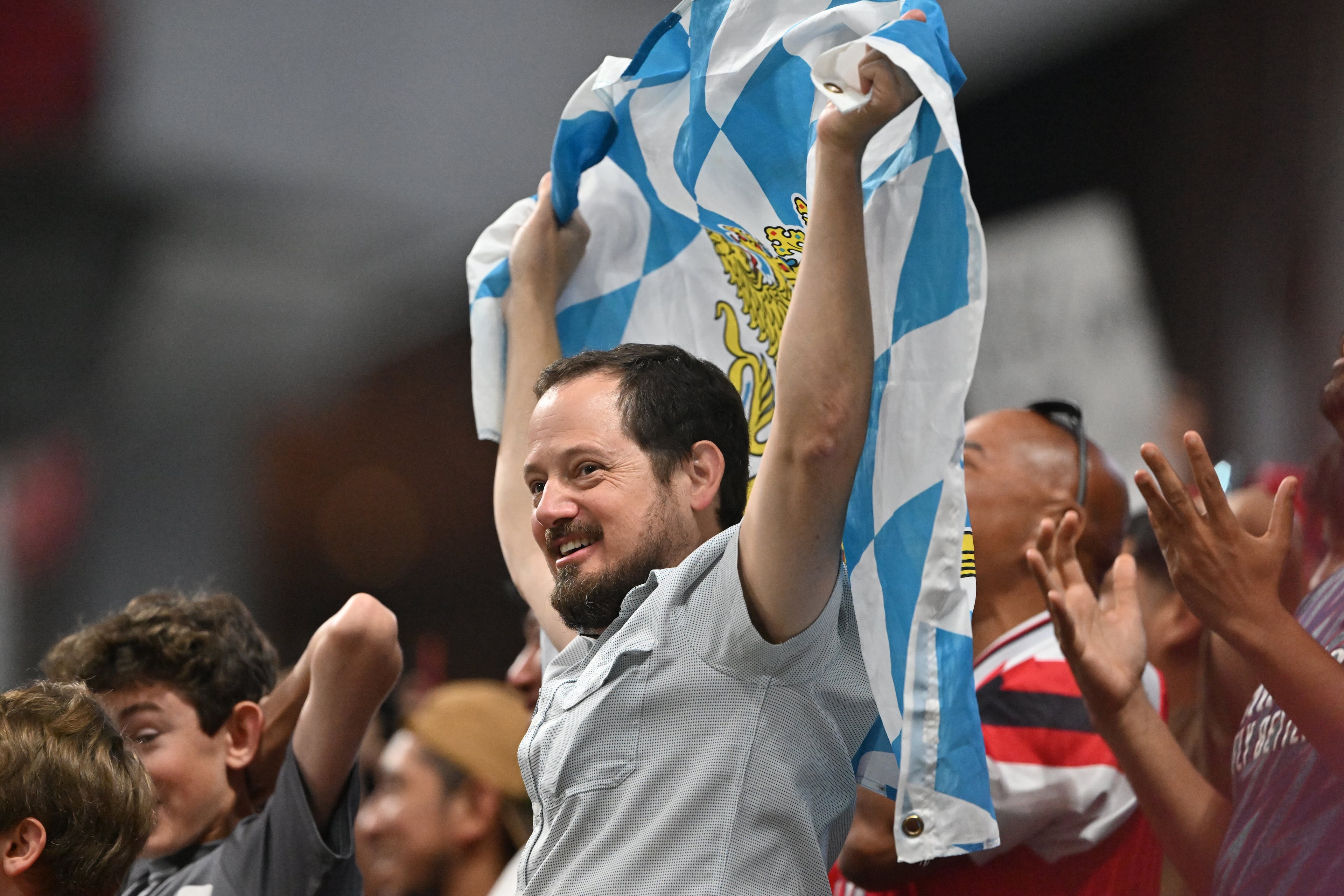 A soccer fan cheers during the second half in Club World Cup quarterfinals match at Mercedes-Benz Stadium, Saturday, July 5, 2025, in Atlanta. Paris Saint-Germain won 2-0 over Bayern Munich. (Hyosub Shin / AJC)
