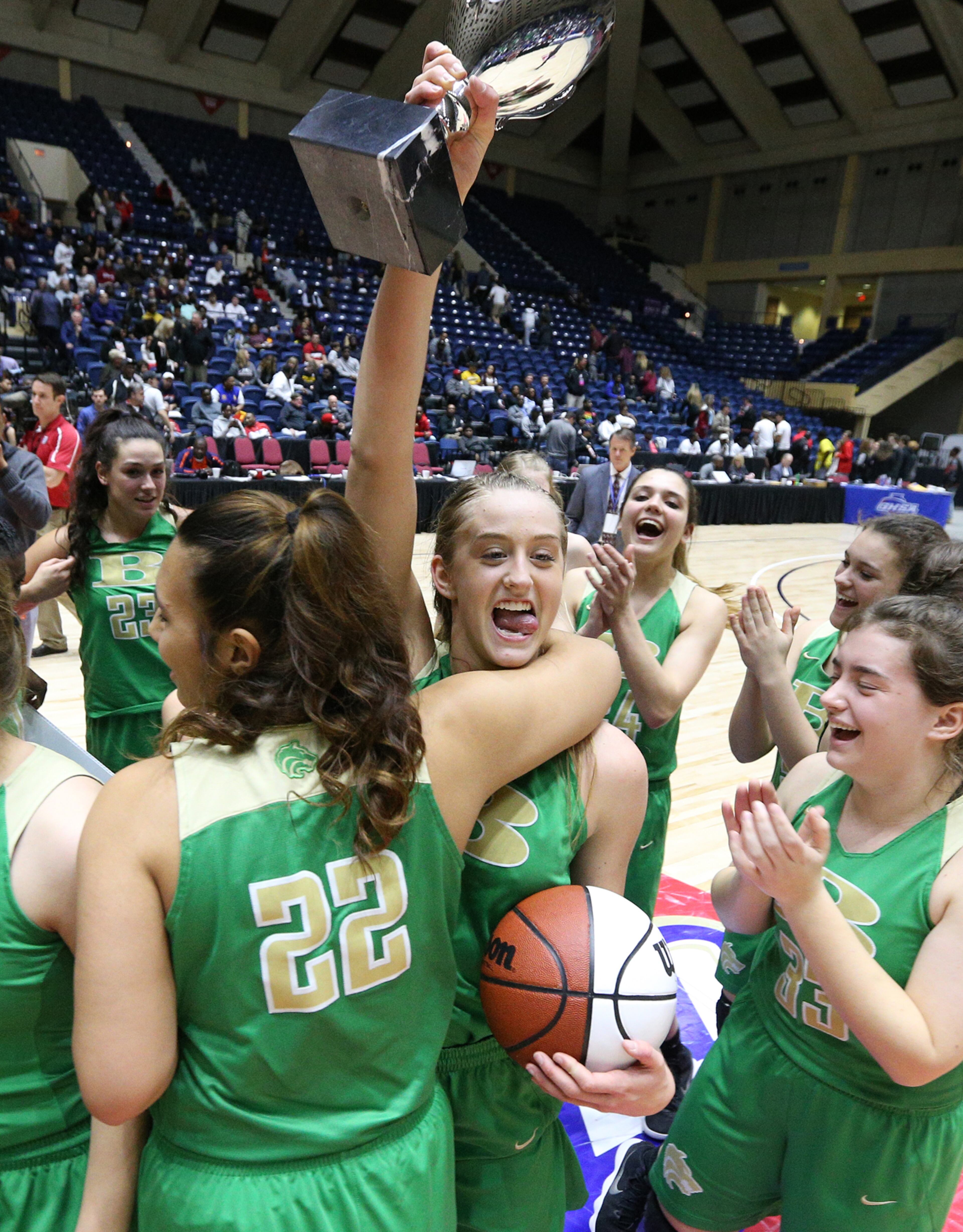 March 8, 2018 Macon: Buford guard Tory Ozment hoists the trophy after beating Flowery Branch 60-49 in their GHSA state basketball championship game on Thursday, March 8, 2018, in Macon. Curtis Compton/ccompton@ajc.com