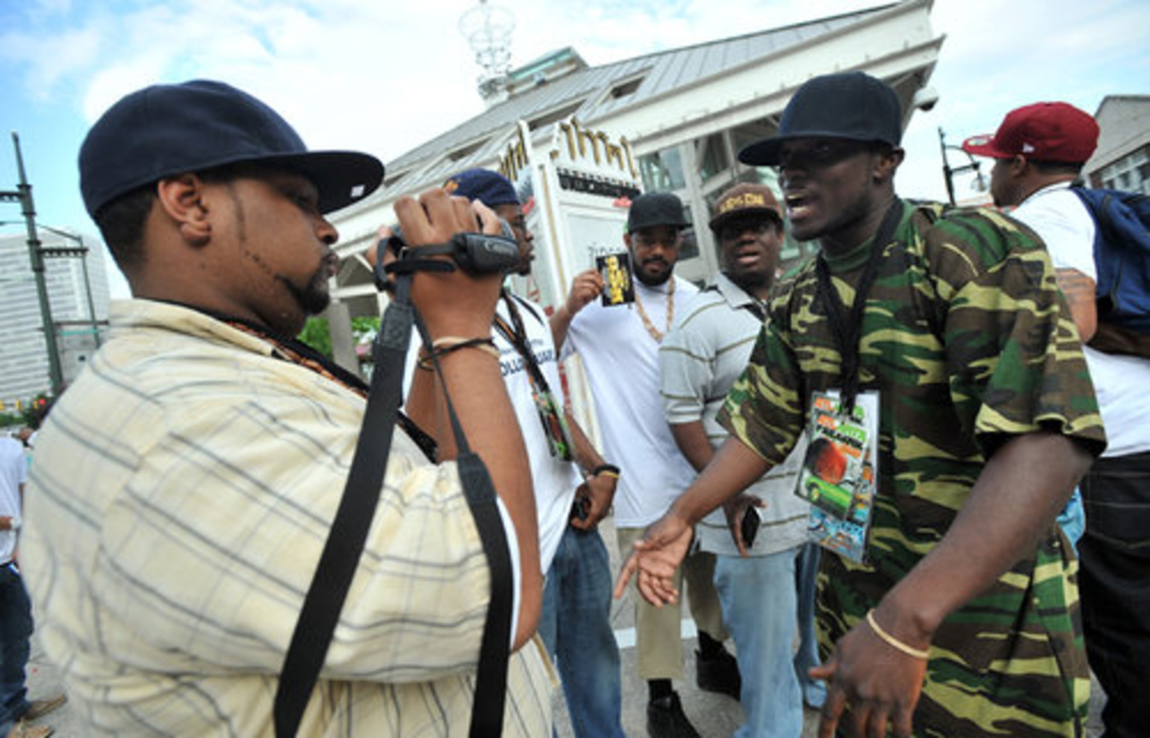 Rapper Trevis Newton (right) performs for Kyle Dupree's camera as they celebrate Freaknik.