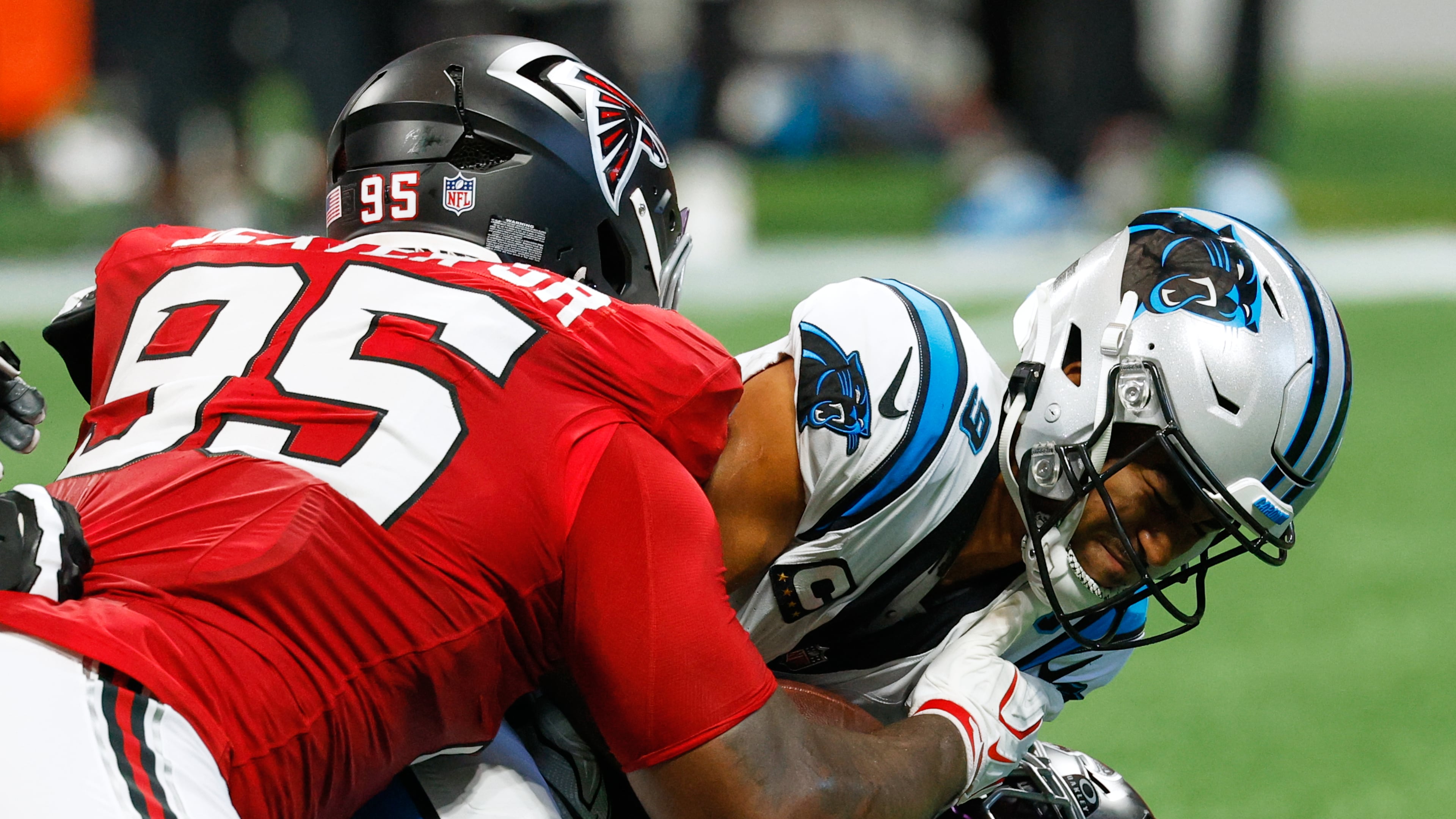 Falcons defensive tackle Gervon Dexter Sr. (left) sacks Panthers quarterback Bryce Young on Sunday, Sept. 20, 2026, in Atlanta. Dexter has 10 quarterback pressures, tied for the second-most in the NFL among interior defensive line, according to Next Gen Stats. (Erik S. Lesser/AP)