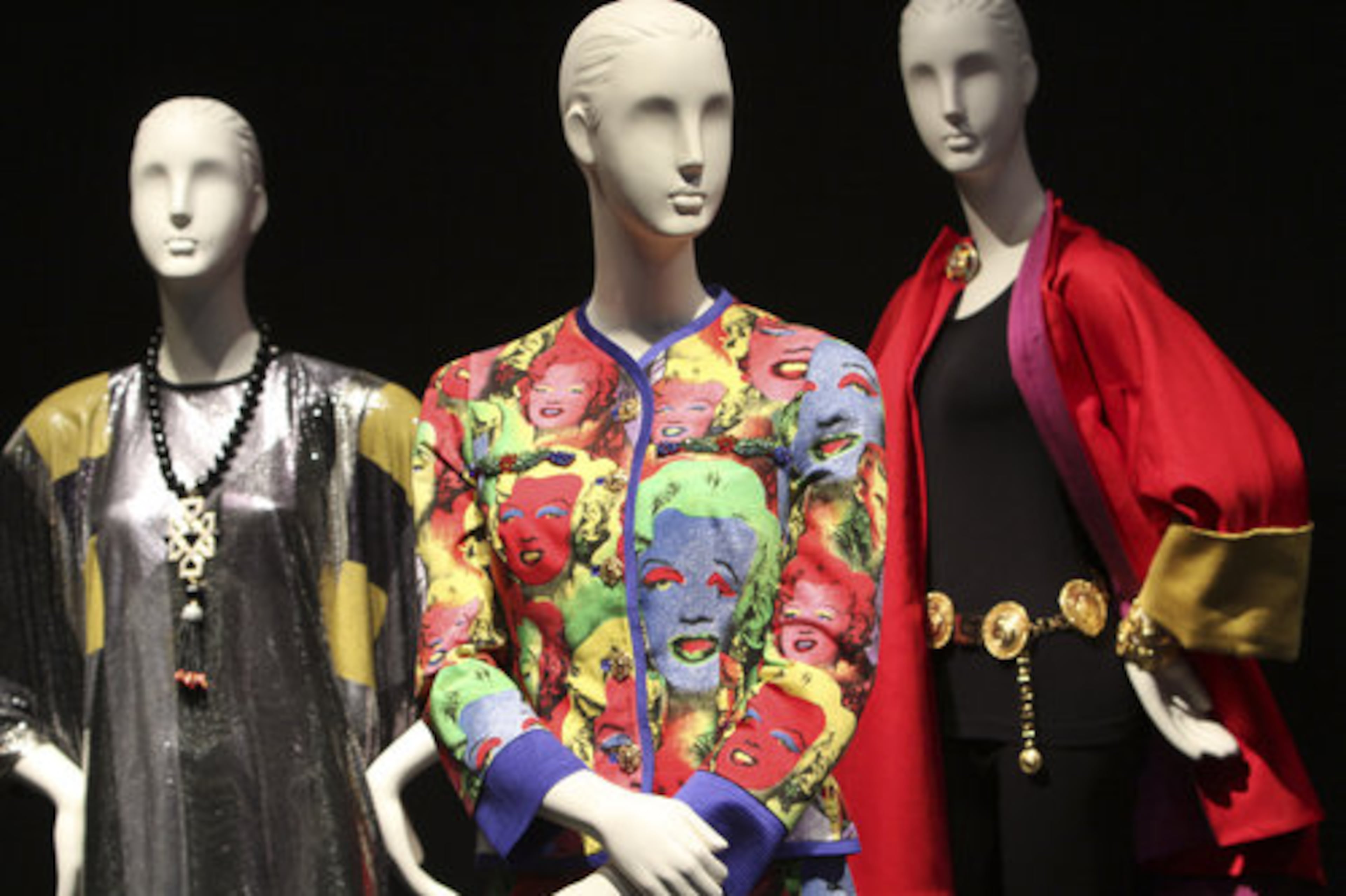 A Versace Polychrome Warhol-Inspired Imagery Suit, center, stands out among the items in the Elizabeth Taylor collection.