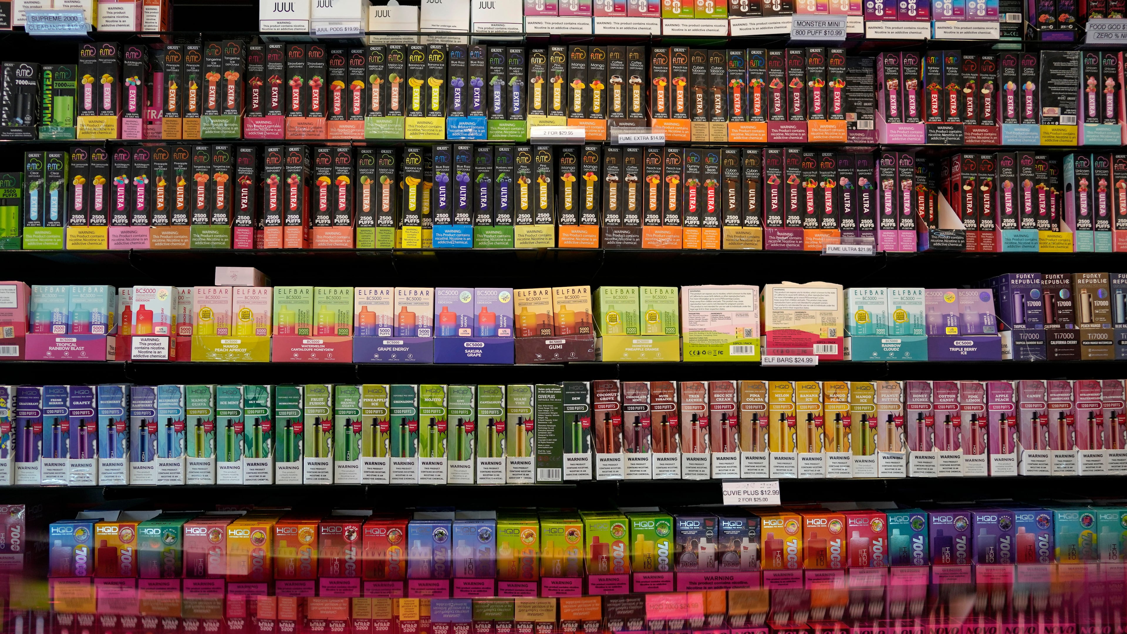 FILE - Disposable flavored electronic cigarette devices are displayed for sale at a store in Pinecrest, Fla., June 26, 2023. (AP Photo/Rebecca Blackwell, File)