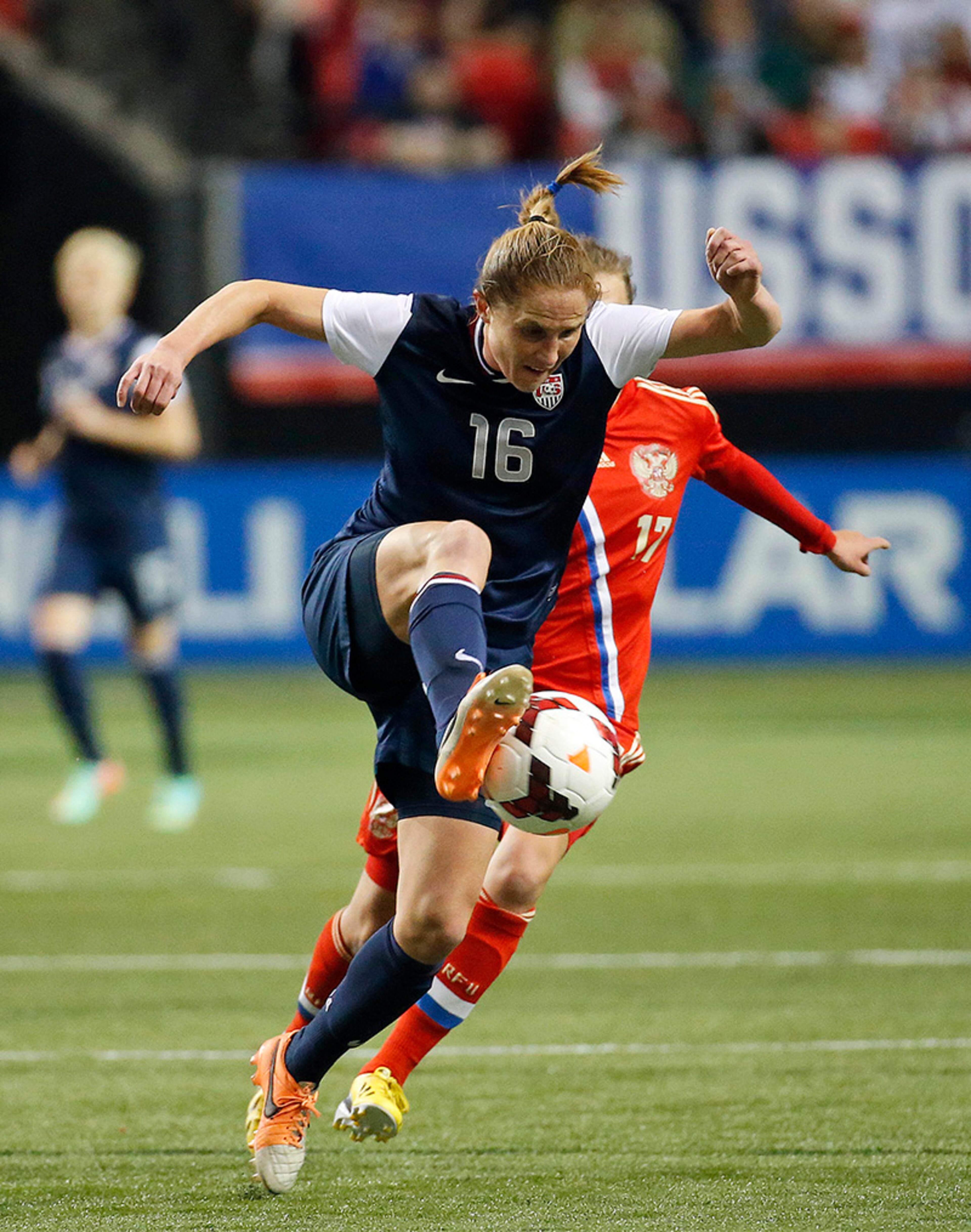 United States' Rachel Van Hollebeke (16) runs down the ball in the first half of an exhibition soccer match against Russia on Thursday, Feb. 13, 2014, at the Georgia Dome in Atlanta.