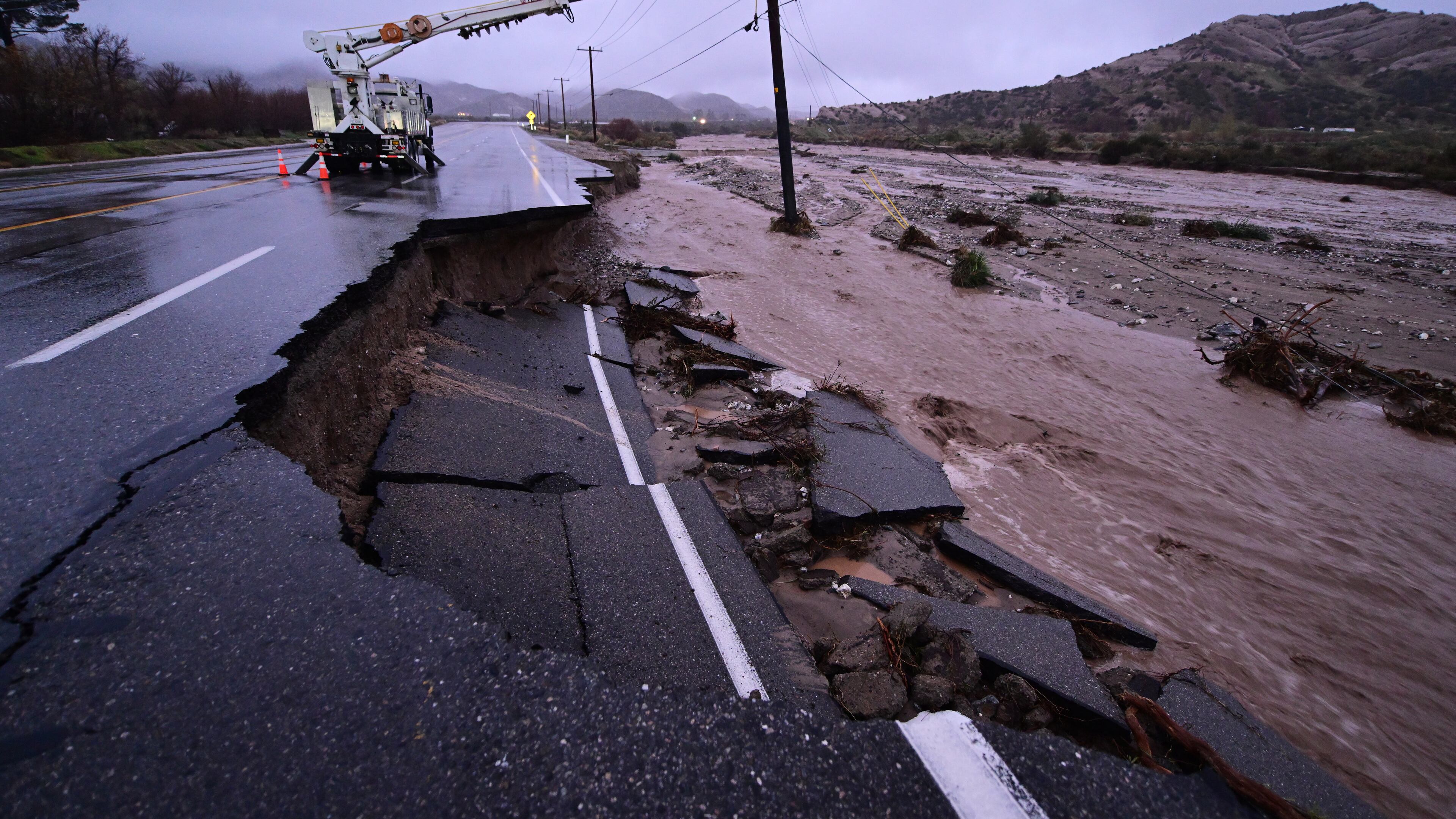 Part of California State Route 138 washes away from flooding Wednesday, Dec. 24, 2025, outside of Wrightwood, Calif. (AP Photo/Wally Skalij)