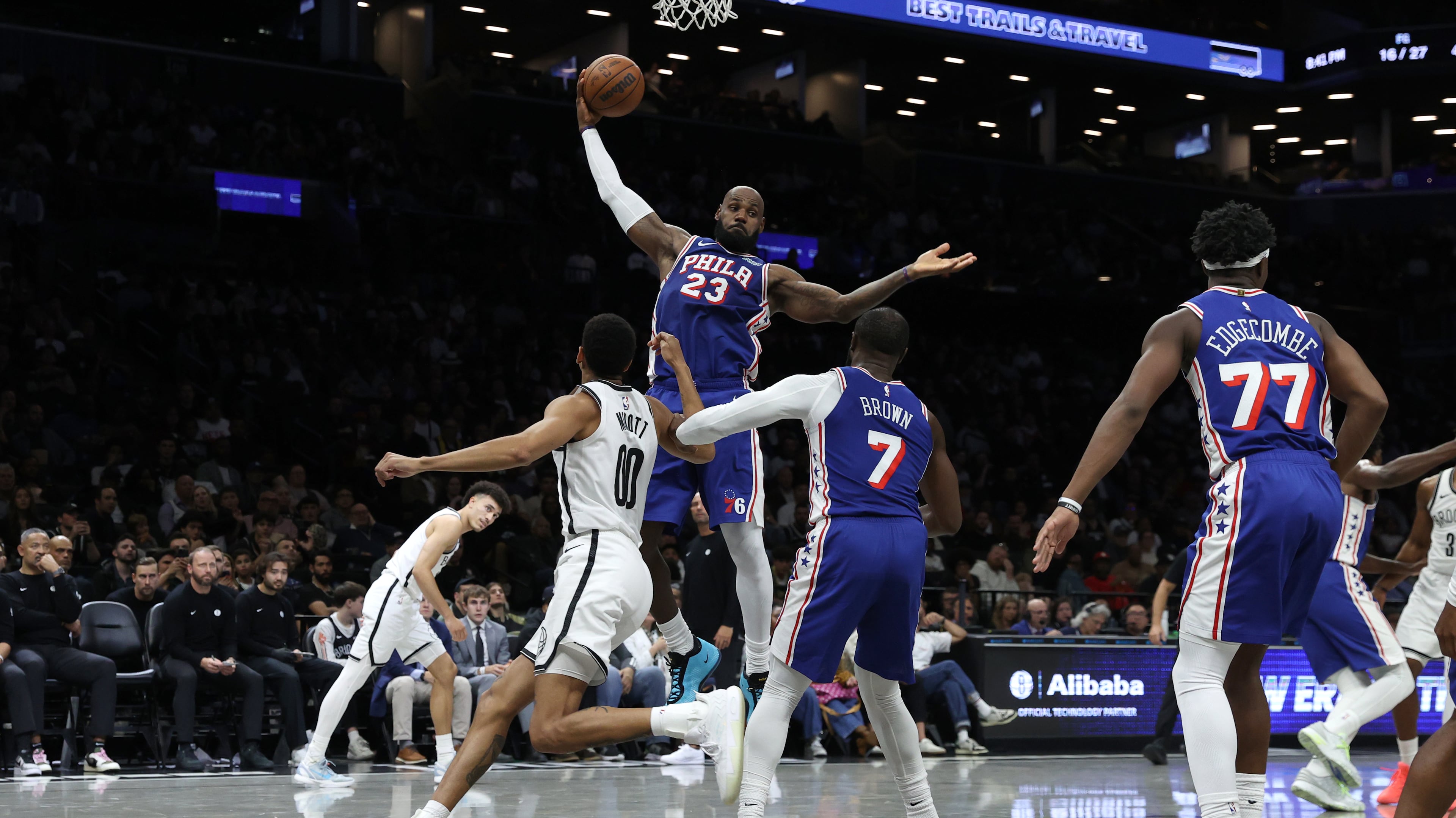 Philadelphia 76ers' LeBron James (23) grabs a rebound during the first half of a preseason NBA basketball game against the Brooklyn Nets, Thursday, Oct. 8, 2026, in New York. (AP Photo/Pamela Smith)