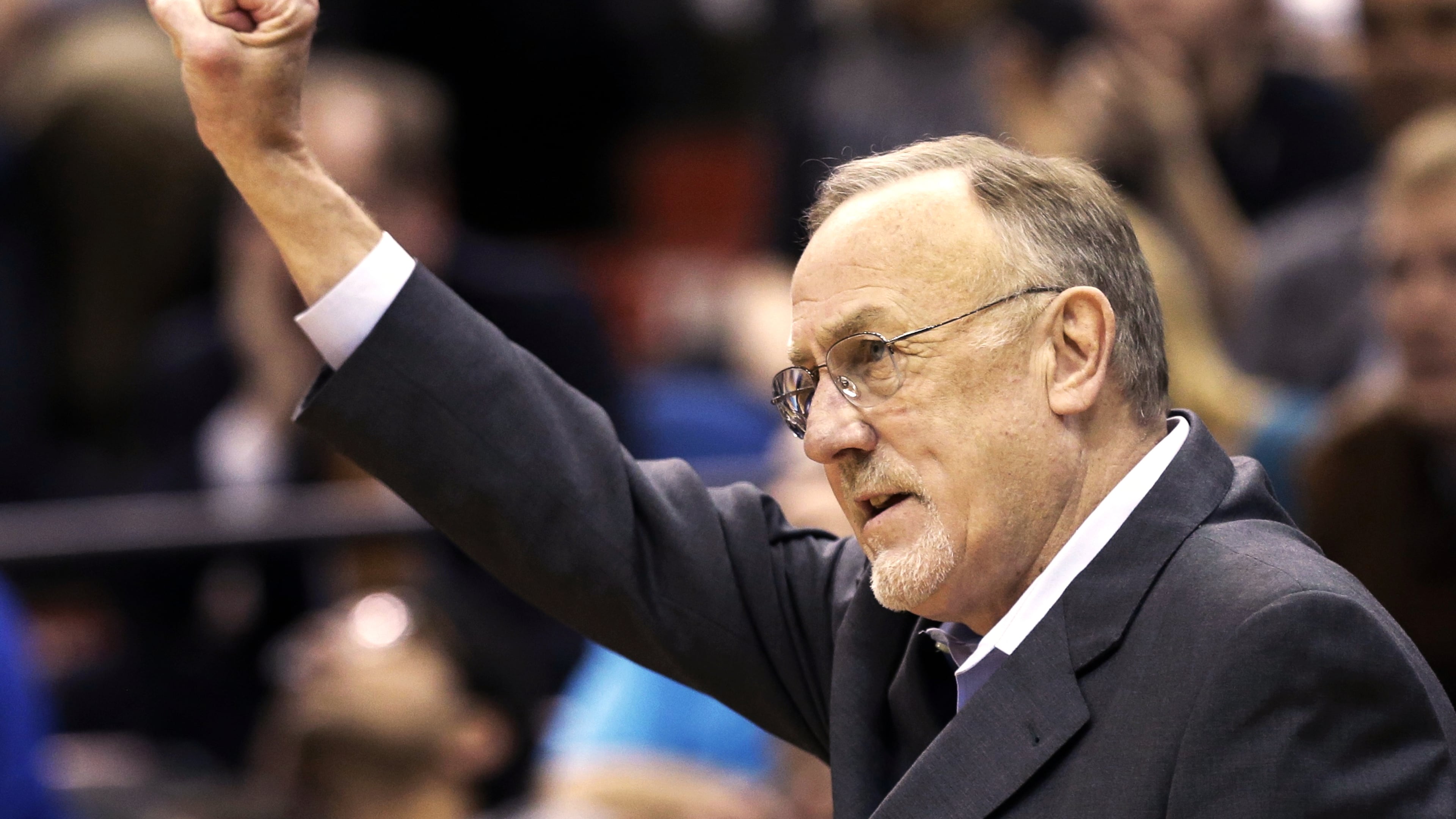 FILE - Minnesota Timberwolves head coach Rick Adelman celebrates a defensive rebound by Ricky Rubio in the second half of an NBA basketball game against Oklahoma City Thunder, March 29, 2013 ,in Minneapolis. (AP Photo/Jim Mone, File)