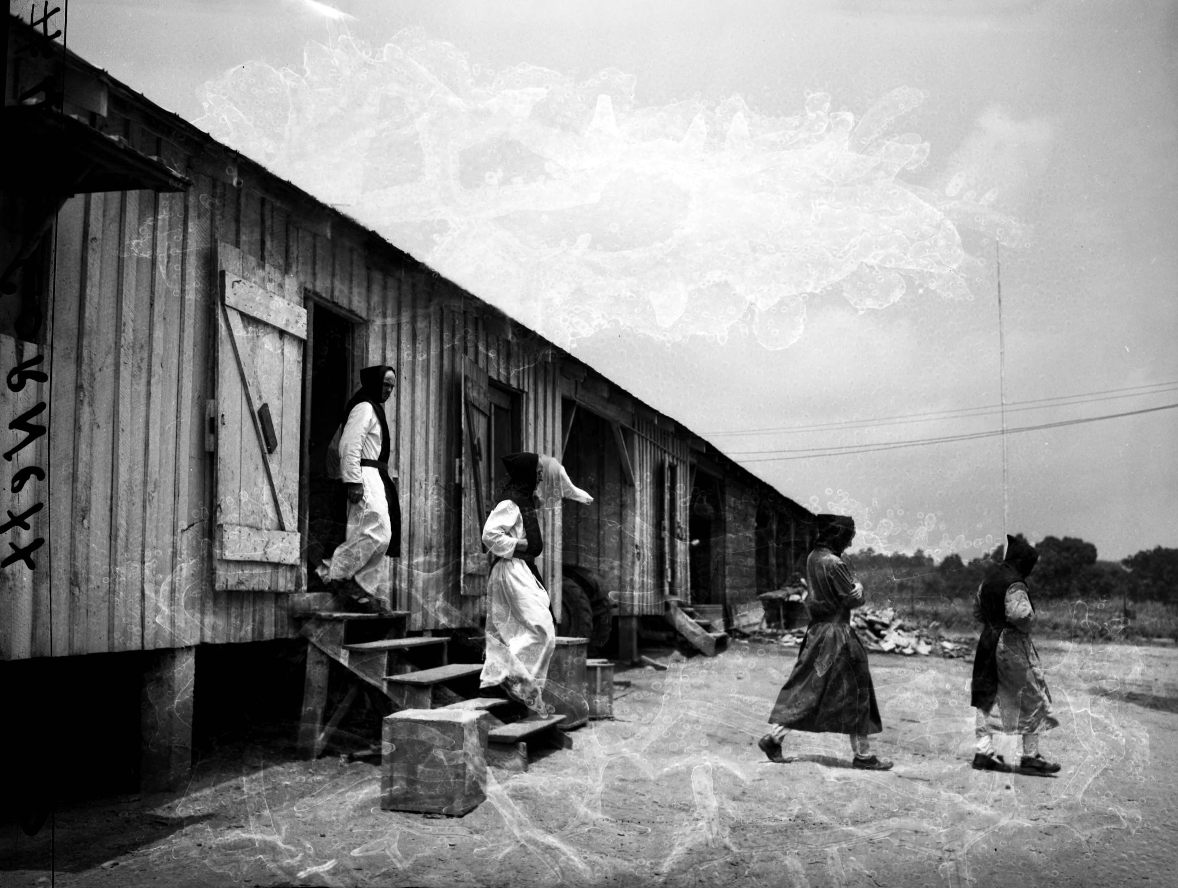 Trappist monks setting up their monastery near Conyers on March 23, 1944. As the website reads today, "In 1944, twenty one Trappist monks left Gethsemani Abbey in Kentucky and embarked on a journey similar to those originating in early Christianity. The trip led them to the wilderness of rural Georgia where they founded the Monastery of the Holy Spirit." N01-086_02, Tracy O'Neal Photographic Collection, 1923-1975, Photographic Collection. Special Collections and Archives, Georgia State University Library.
