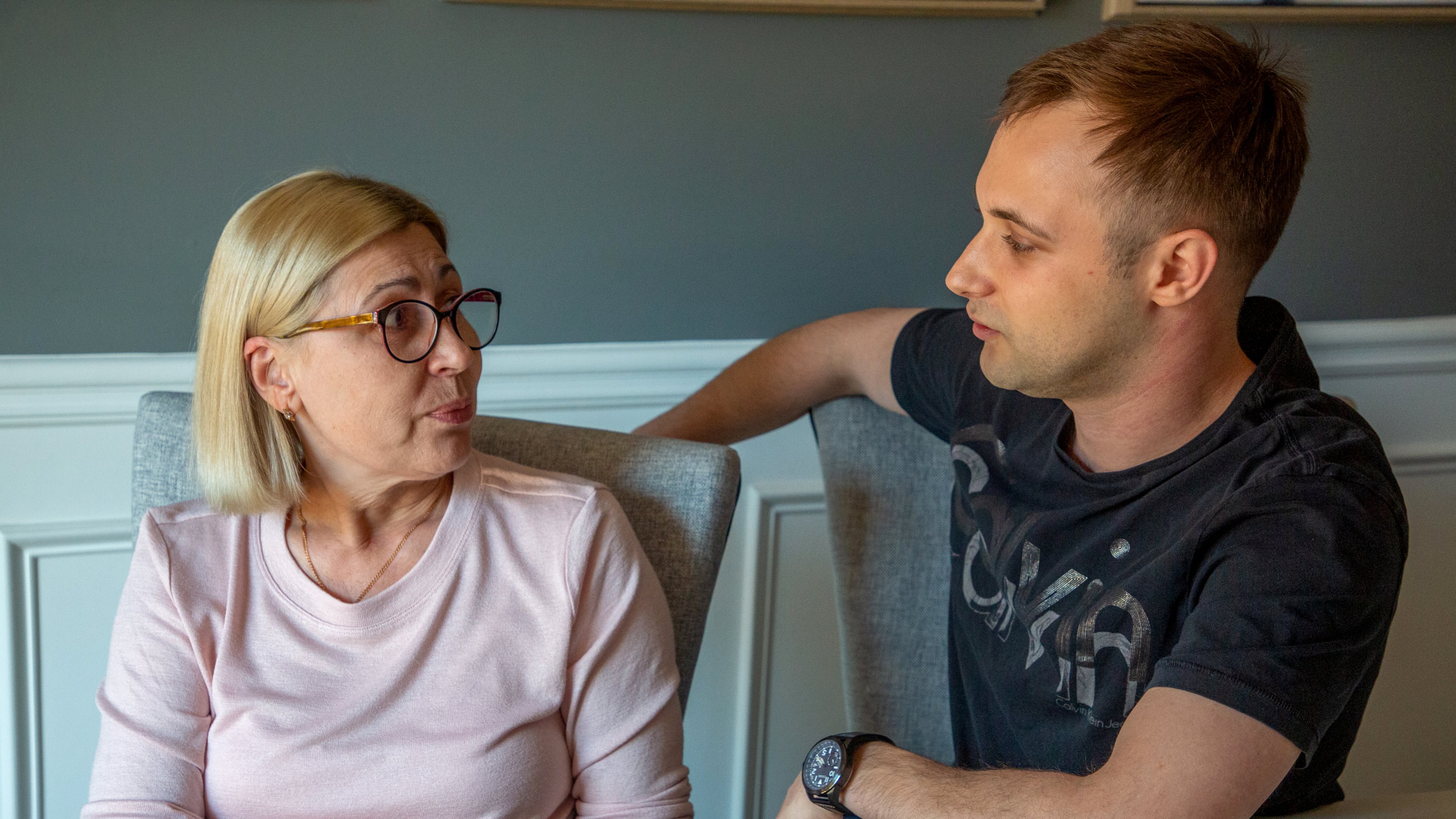 Igor Lutsenko sits in his Lawrenceville home with his mother, Lyudmila Soloshenko, Friday, March 4, 2022. STEVE SCHAEFER FOR THE ATLANTA JOURNAL-CONSTITUTION