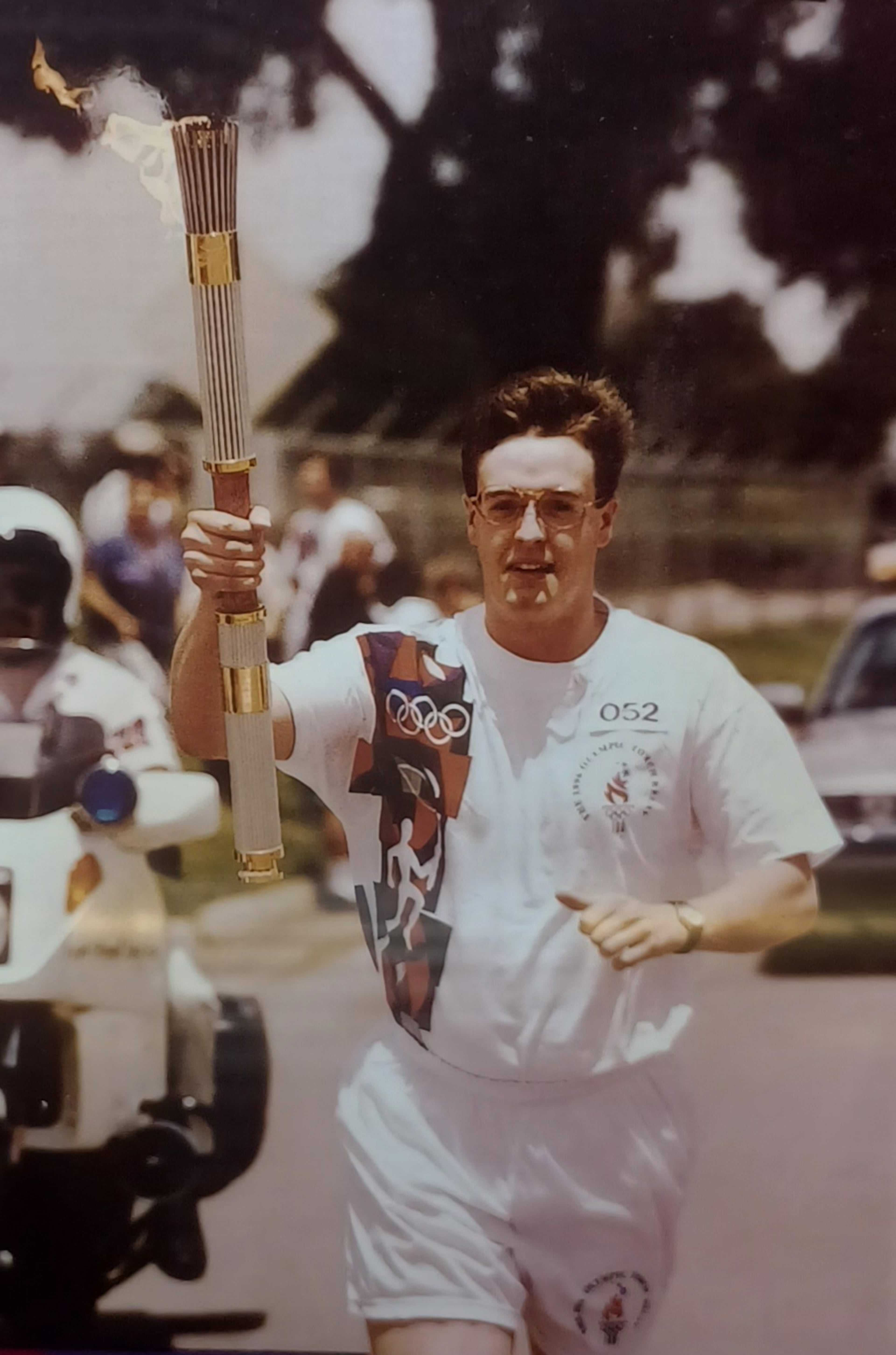 Nicholas Wolaver pictured during the torch relay at the 1996 Olympics. (Atlanta Committee for the Olympic Games/ Courtesy of Nicholas Wolaver)