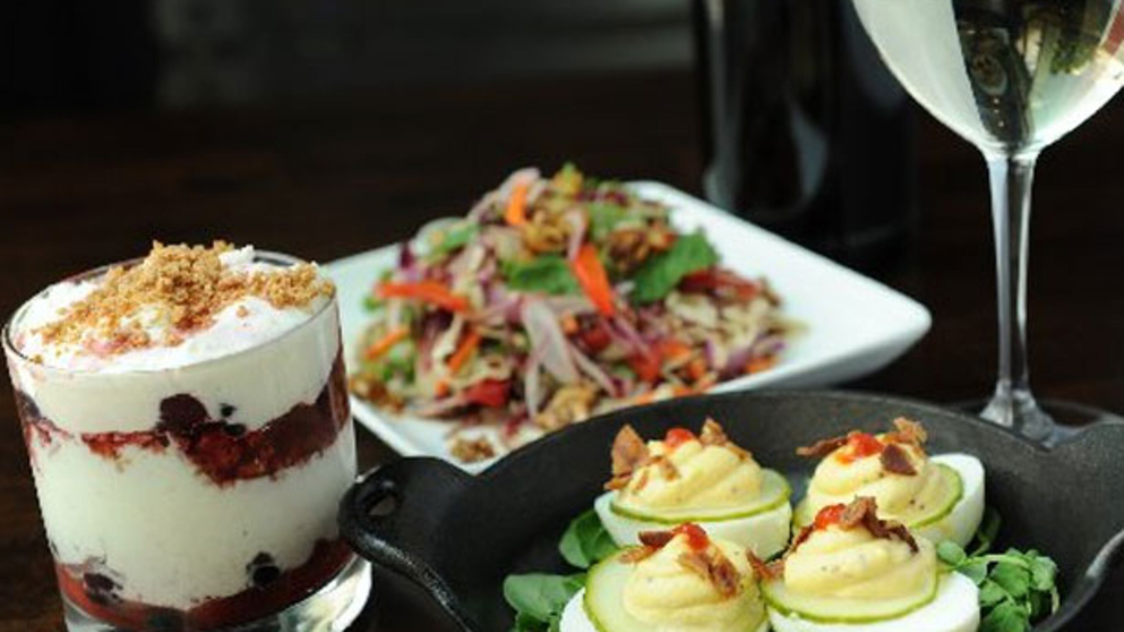 Deviled farm eggs, bacon, sriracha. Raw Thai salad, soy-lime dressing, soy peanuts. Mixed berry parfait, mascarpone, amaretti cookies at Saltyard.