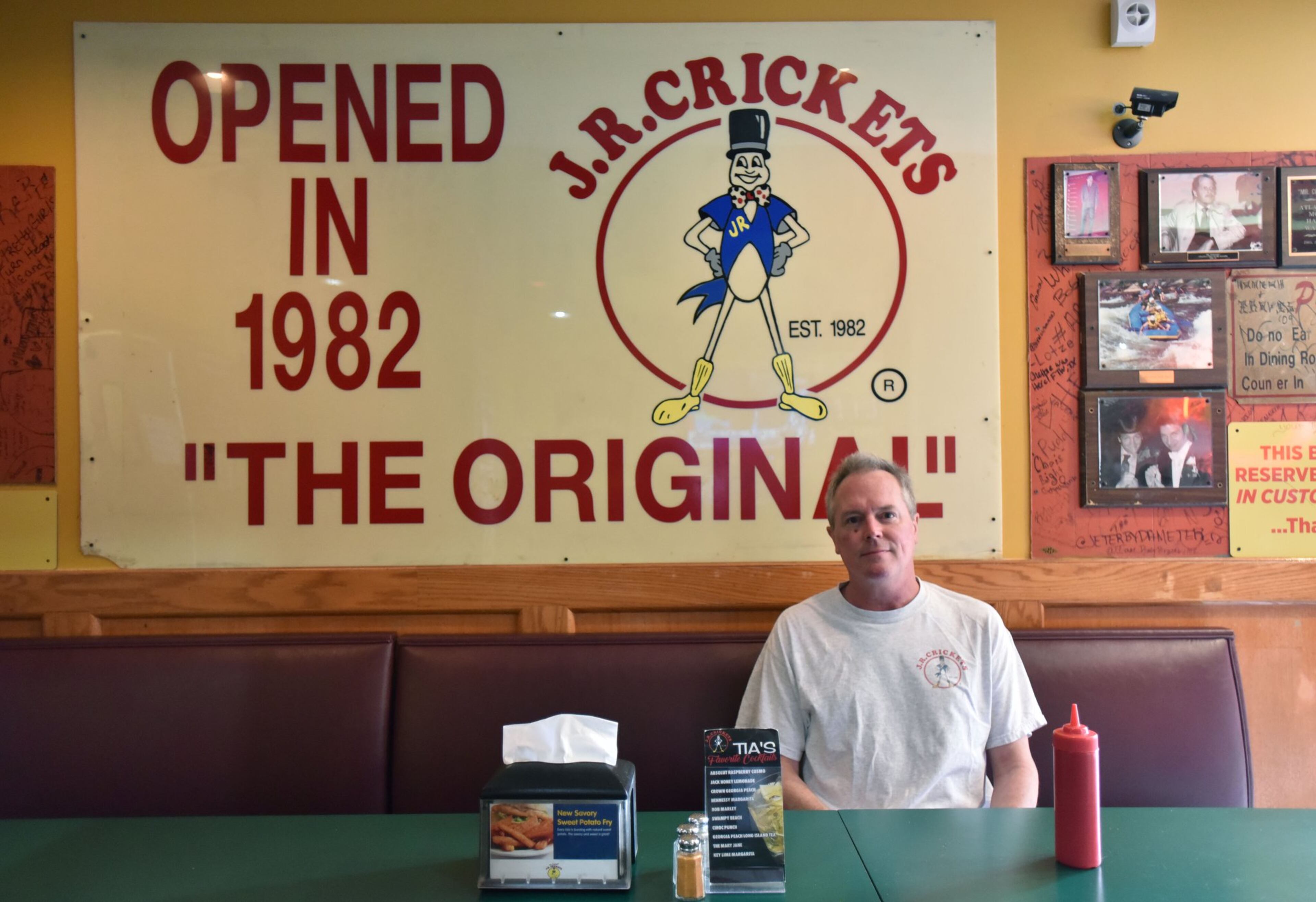February 28, 2017 Atlanta - Portrait of Joel Carr, manager, in front of one of original signs from the first restaurant at Original J.R. Crickets in Midtown Atlanta on Tuesday, February 28, 2017. HYOSUB SHIN / HSHIN@AJC.COM