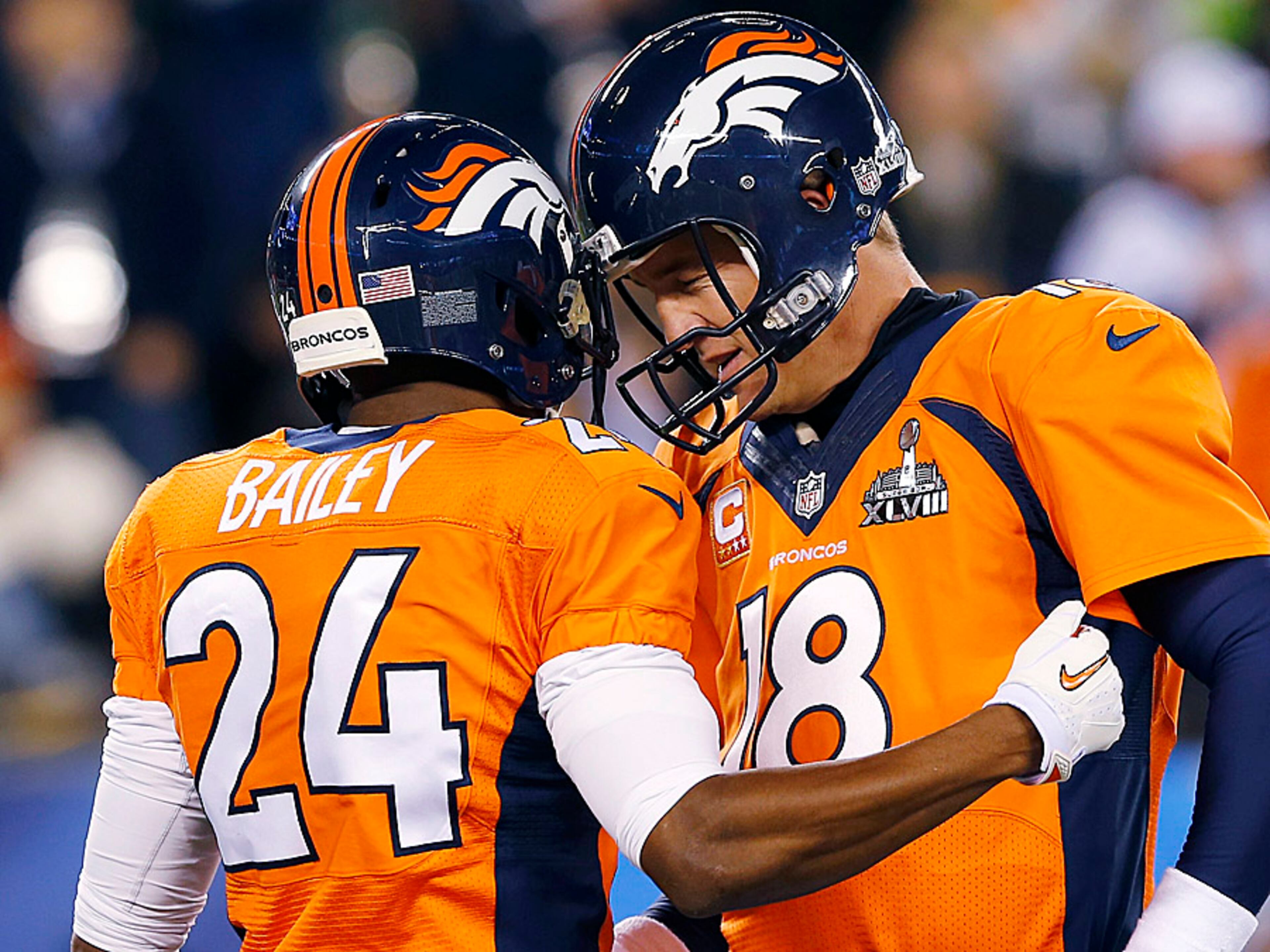 Denver Broncos' Champ Bailey, left, speaks with quarterback Peyton Manning before the NFL Super Bowl XLVIII football game against the Seattle Seahawks on Sunday, Feb. 2, 2014, in East Rutherford, N.J. (AP Photo/Paul Sancya)