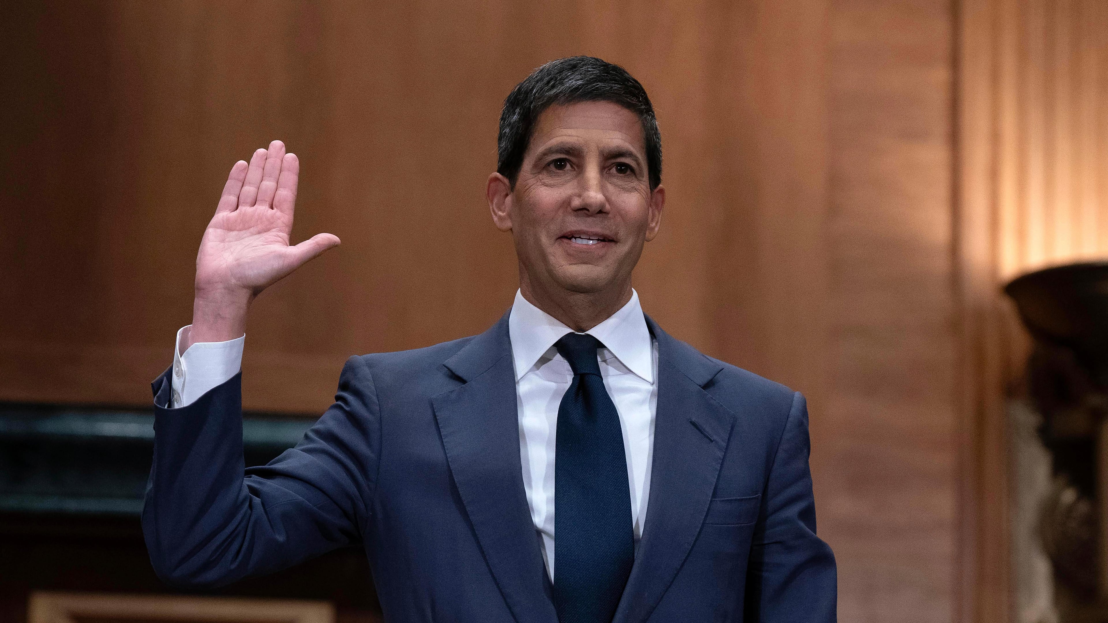 Kevin Warsh is sworn in during his nomination hearing to be a member and chairman of the Federal Reserve Board of Governors before the Senate Banking, Housing and Urban Affairs Committee on Capitol Hill, in Washington Tuesday, April 21, 2026. (AP Photo/Jose Luis Magana)