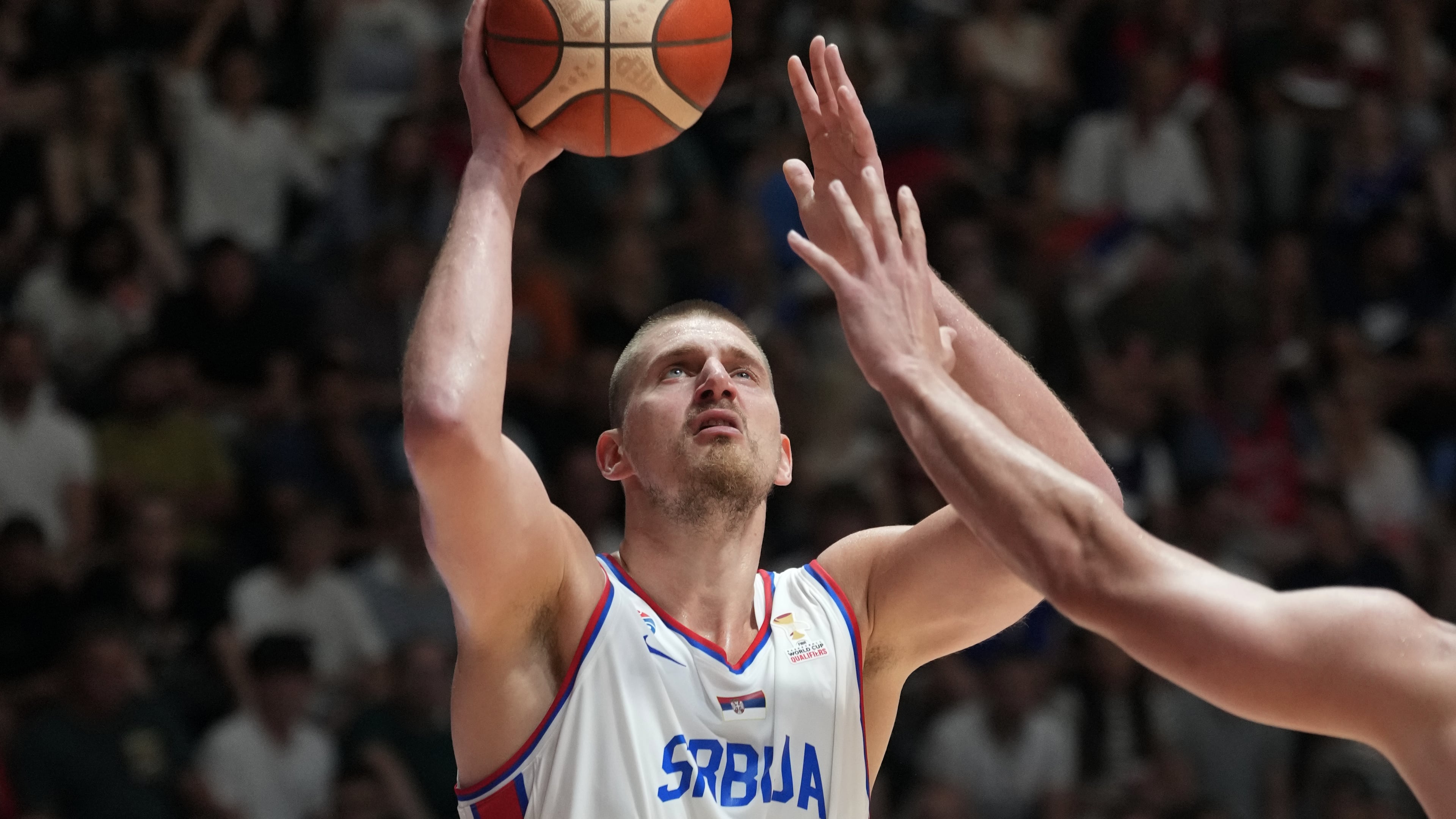 Serbia's Nikola Jokic tries to score as Bosnia's Luka Garza blocks him during their FIBA Basketball World Cup 2027 European qualifiers match between Serbia and Bosnia, in Belgrade, Serbia, Monday, July 6, 2026. (AP Photo/Darko Vojinovic)