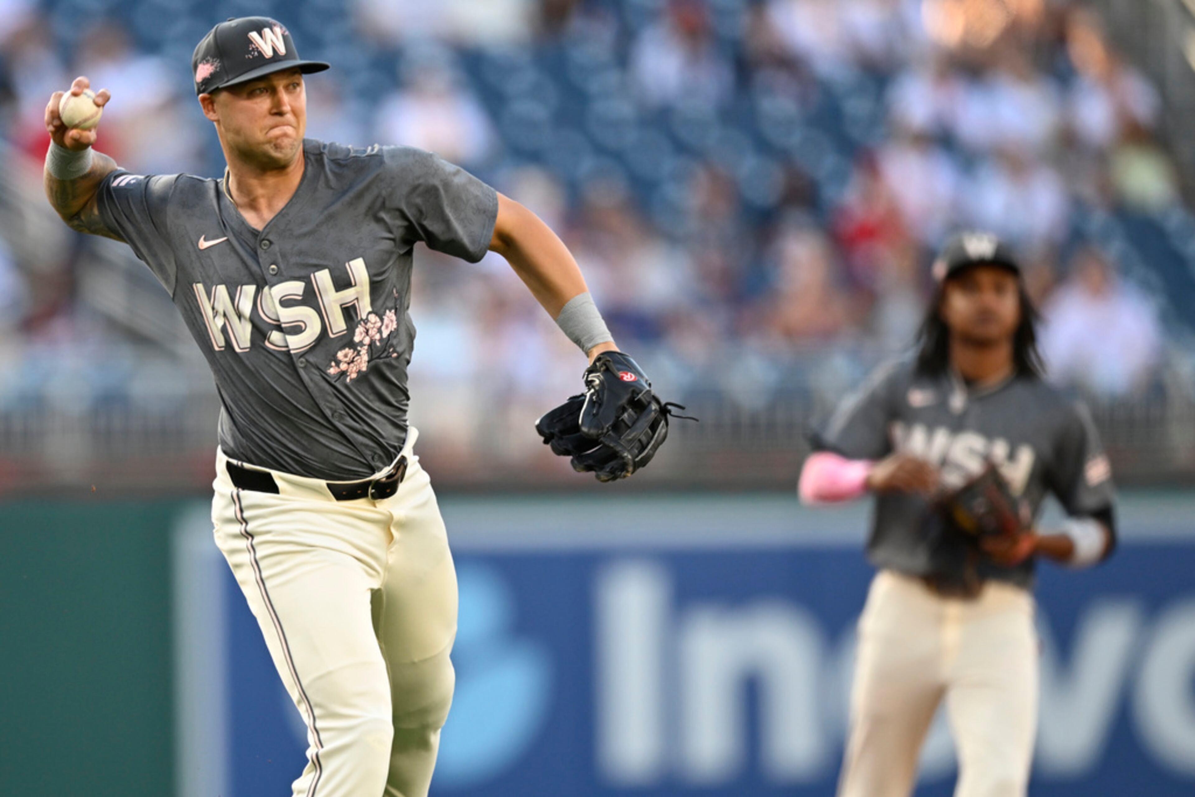 Washington Nationals third baseman Nick Senzel throws out Atlanta Braves' Austin Riley during the first inning of a baseball game Friday, June 7, 2024, in Washington. (AP Photo/John McDonnell)