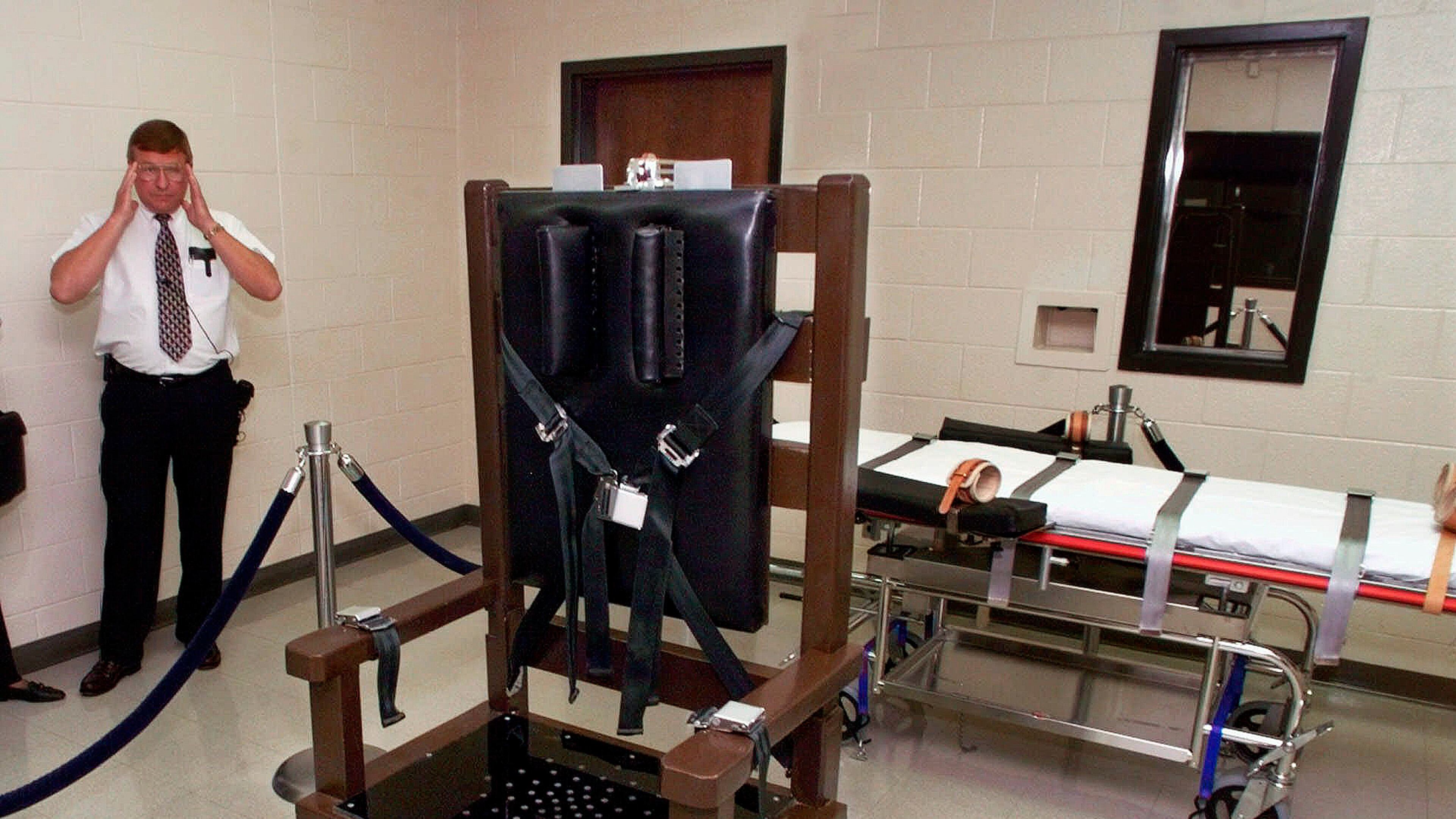 FILE - Ricky Bell, warden at Riverbend Maximum Security Institution in Nashville, Tenn., gives a tour of the prison's execution chamber, Oct. 13, 1999. (AP Photo/Mark Humphrey, File)