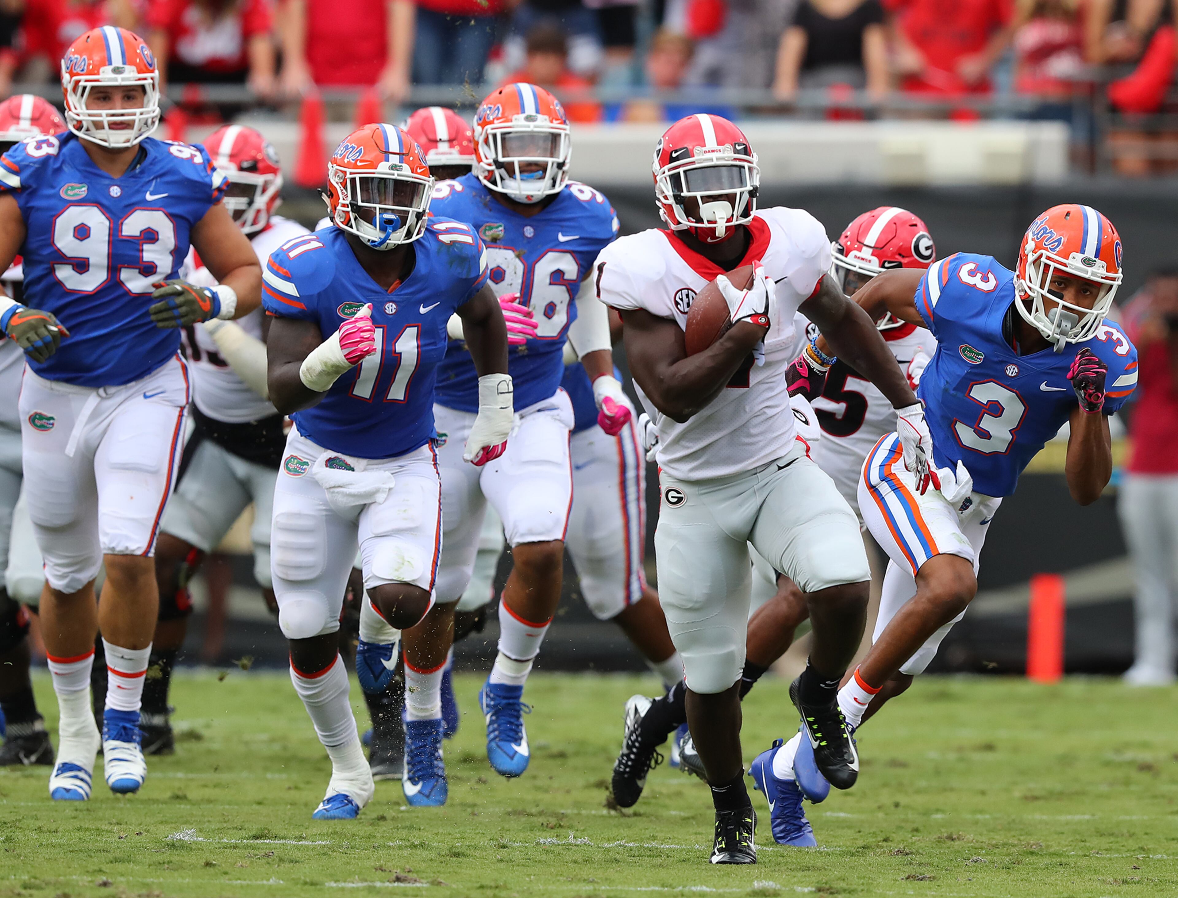 October 28, 2017 Jacksonville: Georgia tailback Sony Michel breaks away from Florida defenders for a long touchdown run to take a 21-0 lead during the first quarter in the Georgia-Florida NCAA college football game on Friday, October 27, 2017, in Jacksonville. Curtis Compton/ccompton@ajc.com