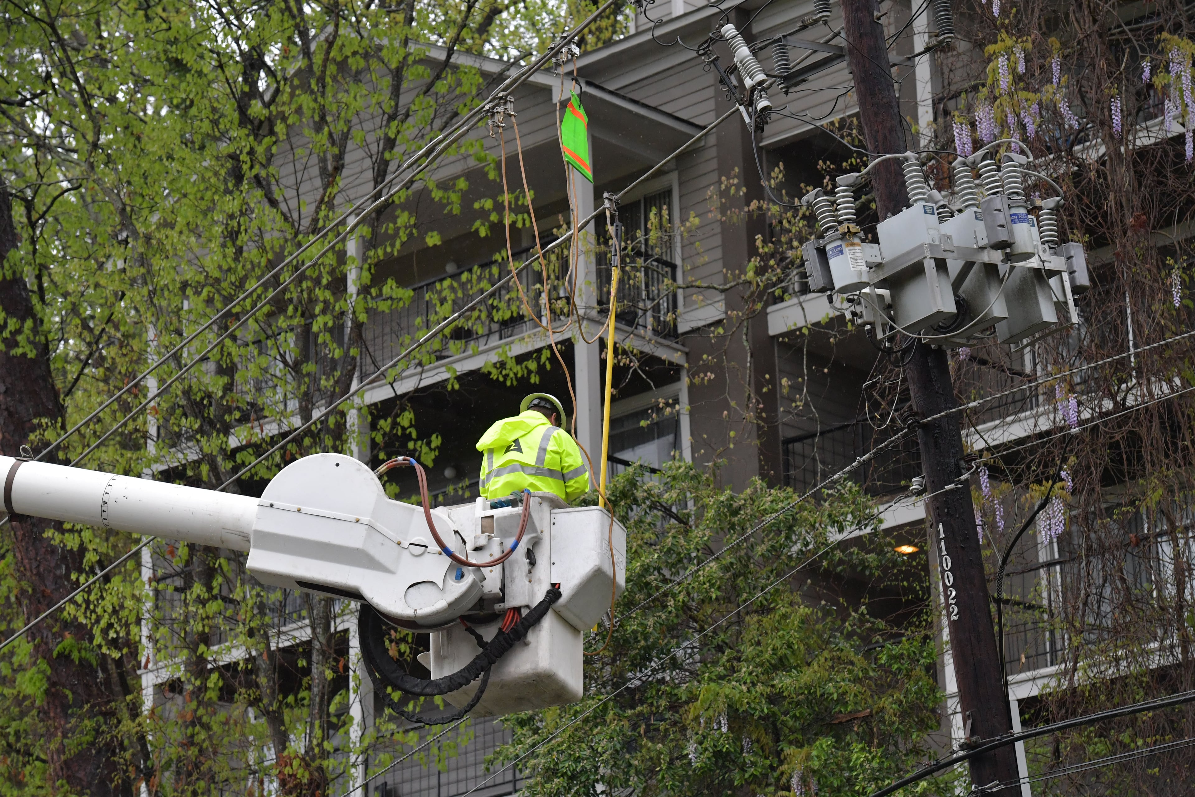April 5, 2017 Roswell - Georgia Power crews work to restore power lines along Azalea Drive in Roswell on Wednesday, April 5, 2017. The threat of severe weather has resulted in multiple cancellations and delays. Thousands of outages across metro Atlanta during weather advisory. HYOSUB SHIN / HSHIN@AJC.COM