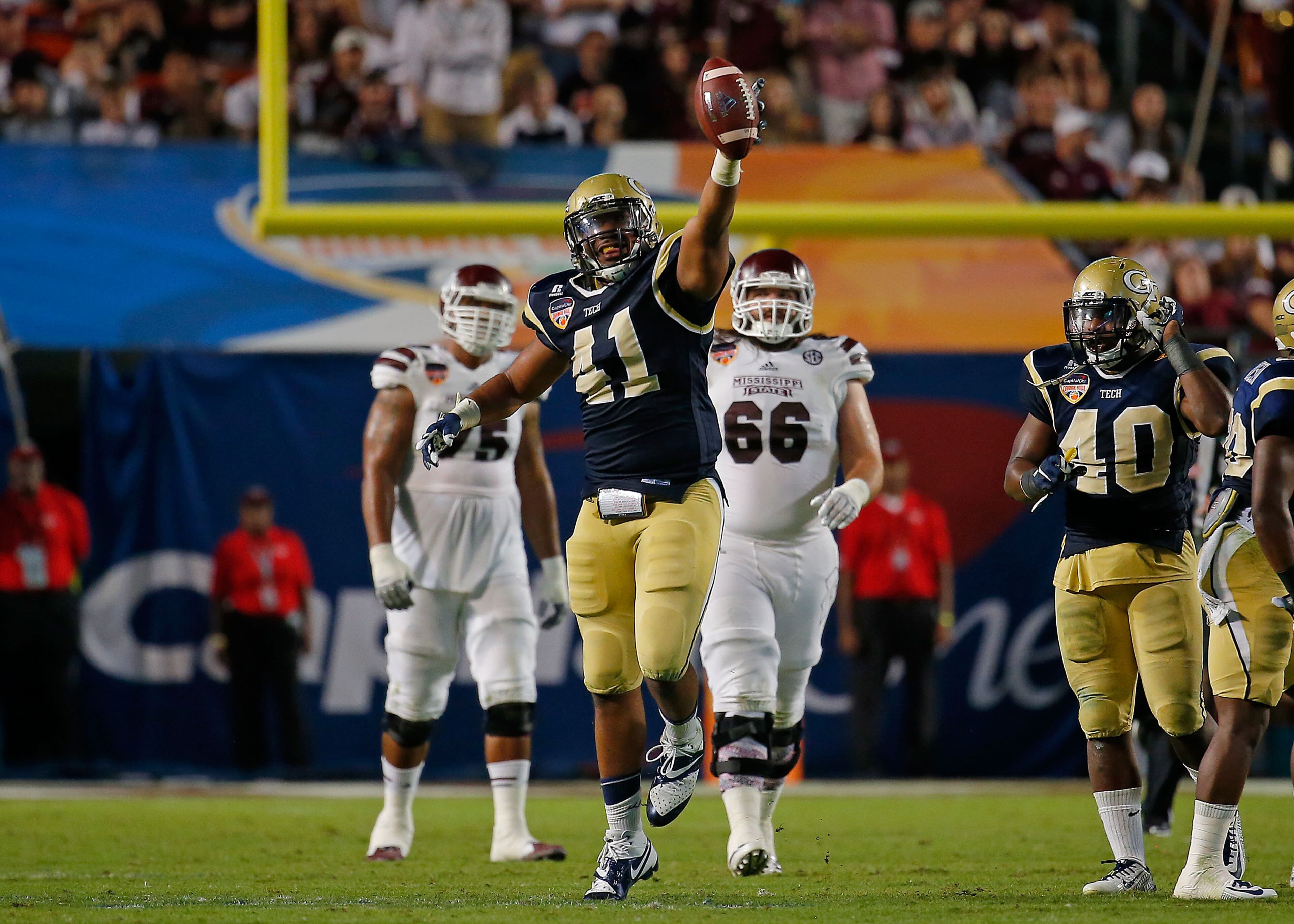 Defensive end Rod Rook-Chungong: He reacts after intercepting a pass during the Orange Bowl against the Mississippi State on Dec. 31, 2014. (Photo by Chris Trotman/Getty Images)