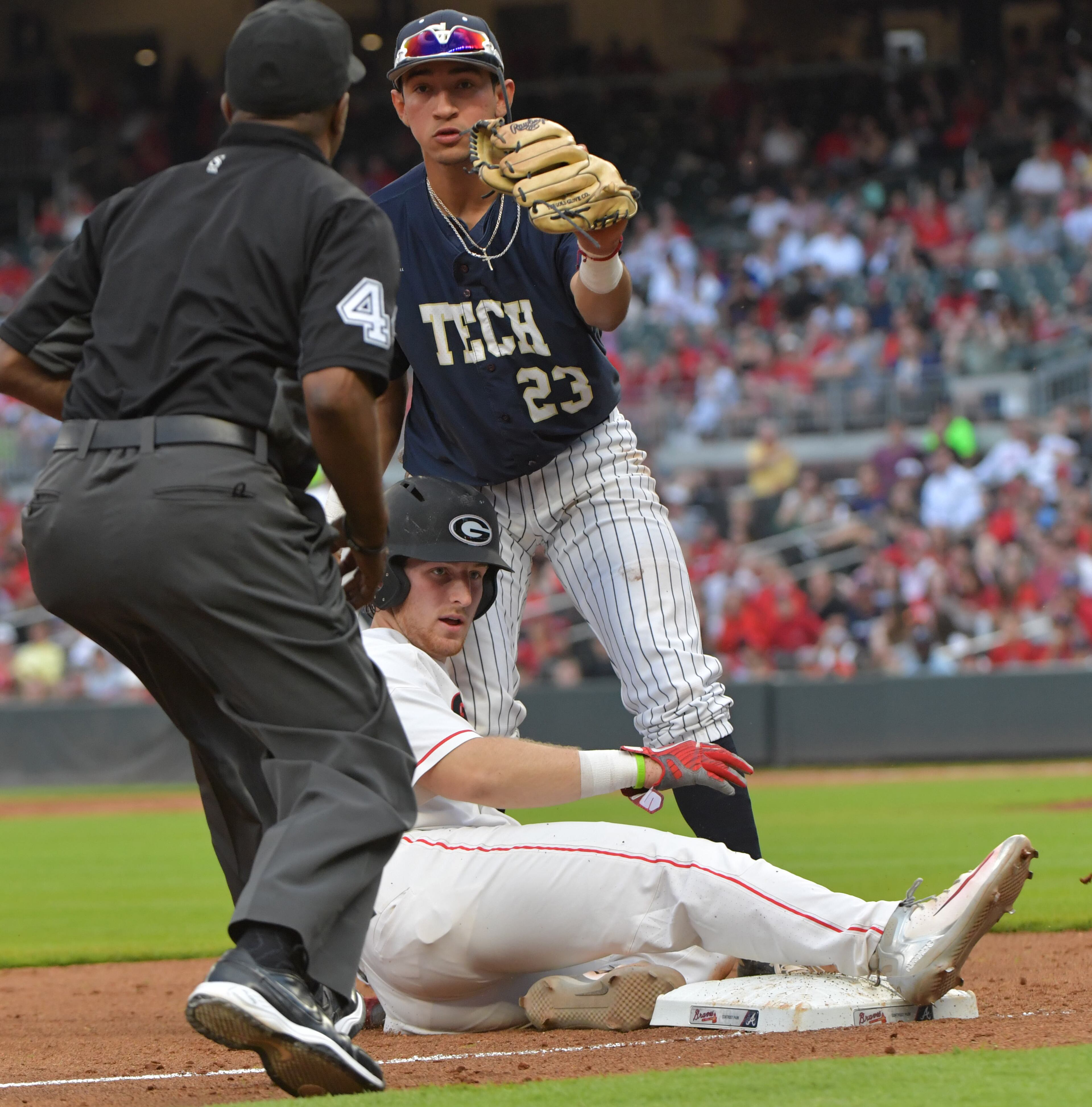 May 8, 2018 Atlanta - Georgia Tech Oscar Serratos (23) tags out Georgia catcher Mason Meadows (30) in the 3rd inning in the 16th annual Farmview Market Spring Classic during a NCAA college baseball game at SunTrust Park on Tuesday, May 8, 2018. HYOSUB SHIN / HSHIN@AJC.COM
