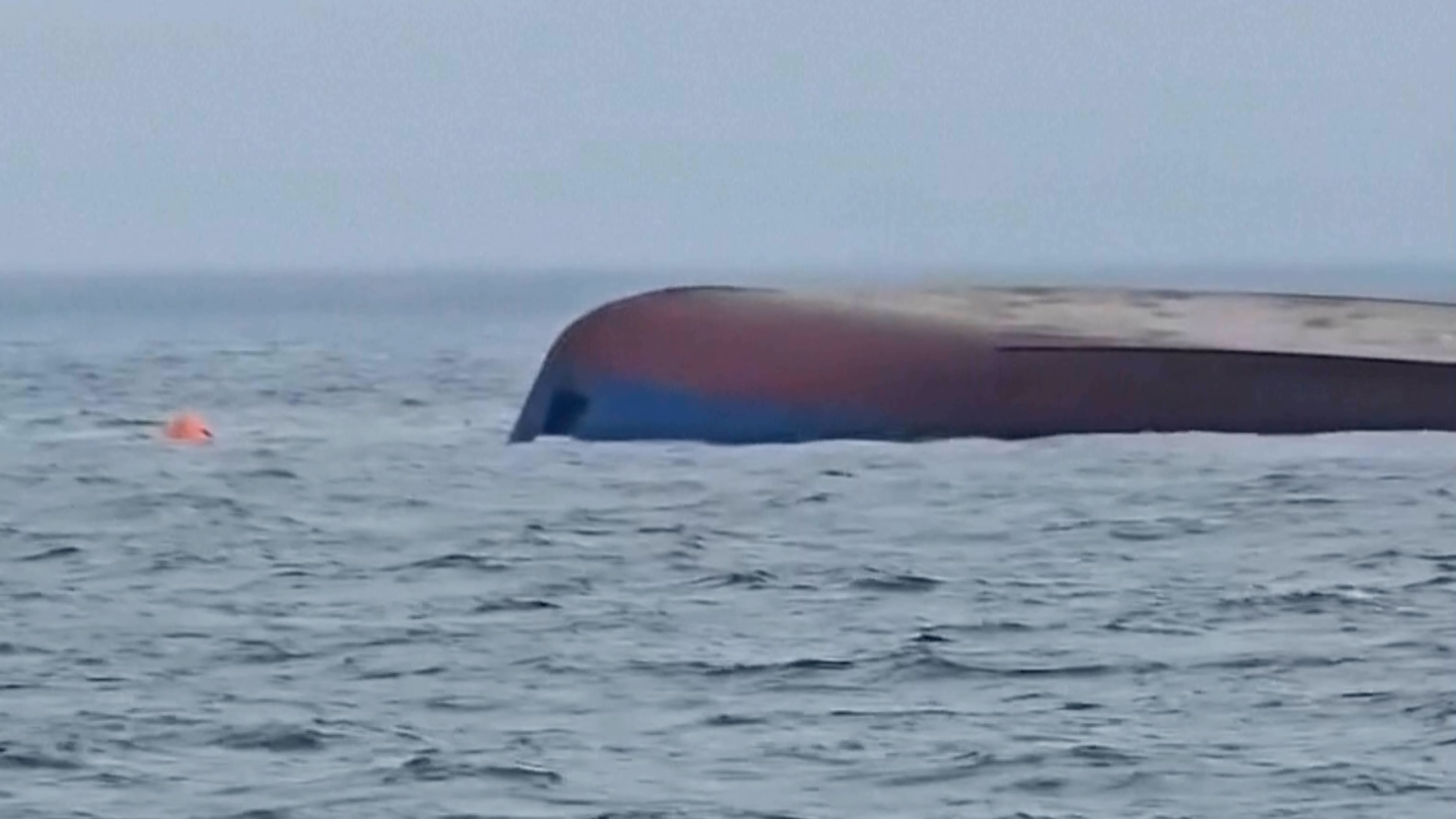 This image from video provided by Romanian Ministry For Internal Affairs shows a ship that capsized after a drone attack in the Black Sea, about 13 nautical miles (15 miles) east of the port city of Constanta, near Romania's territorial waters. on Friday, Oct. 23, 2026. (Romanian Ministry For Internal Affairs via AP)