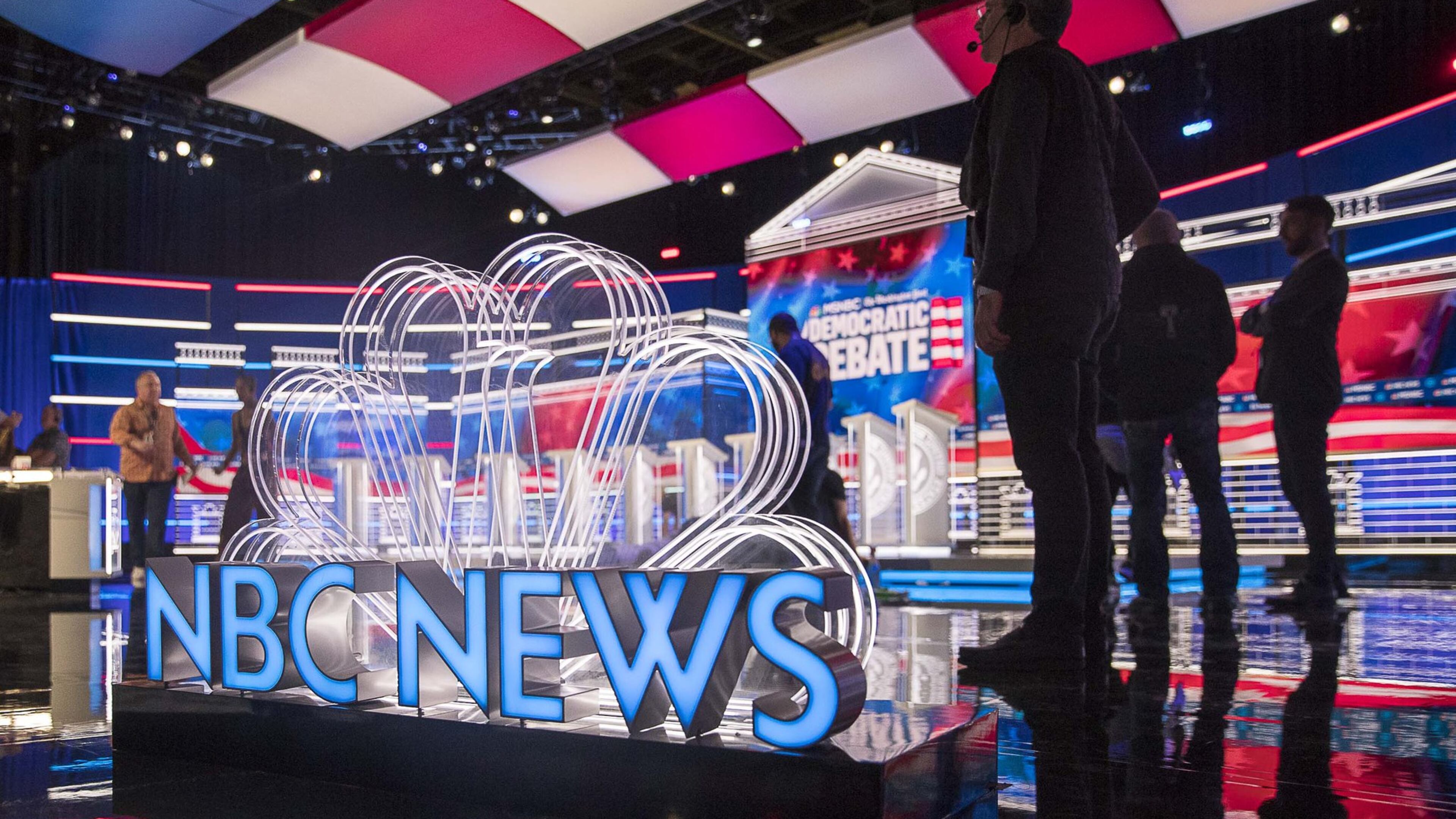 Crews continue to work Tuesday on the final touches of the stage a day before the Democratic presidential debate inside the Oprah Winfrey Soundstage at Tyler Perry Studios in Atlanta. MSNBC and The Washington Post are sponsors of the debate. (Alyssa Pointer/Atlanta Journal Constitution)