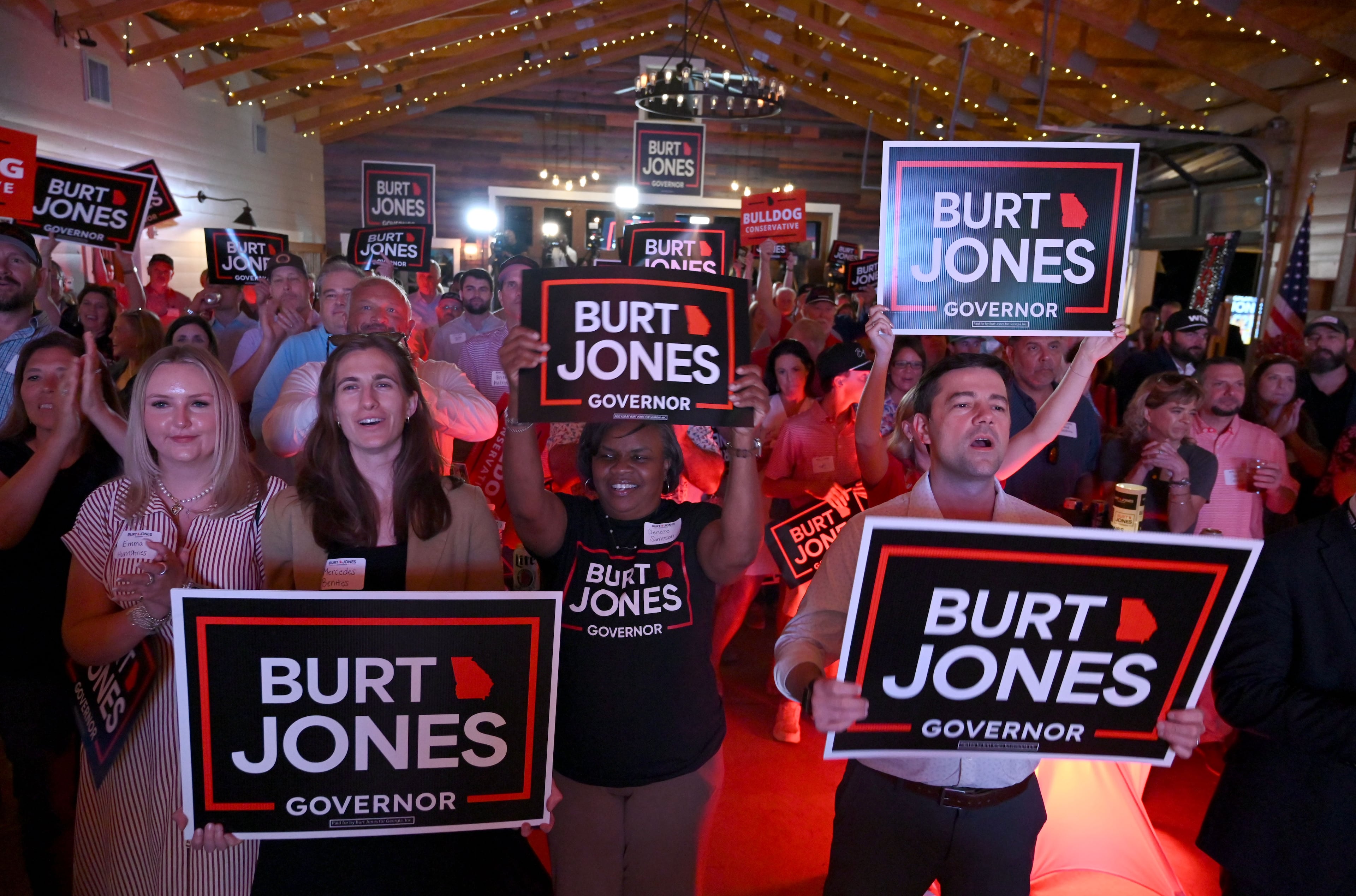 Supporters cheer as Georgia gubernatorial candidate Burt Jones addresses supporters at his election night party at The Rivers Ranch during the 2026 Georgia primary elections Tuesday, May 19, 2026, in Jackson. (Hyosub Shin/AJC)