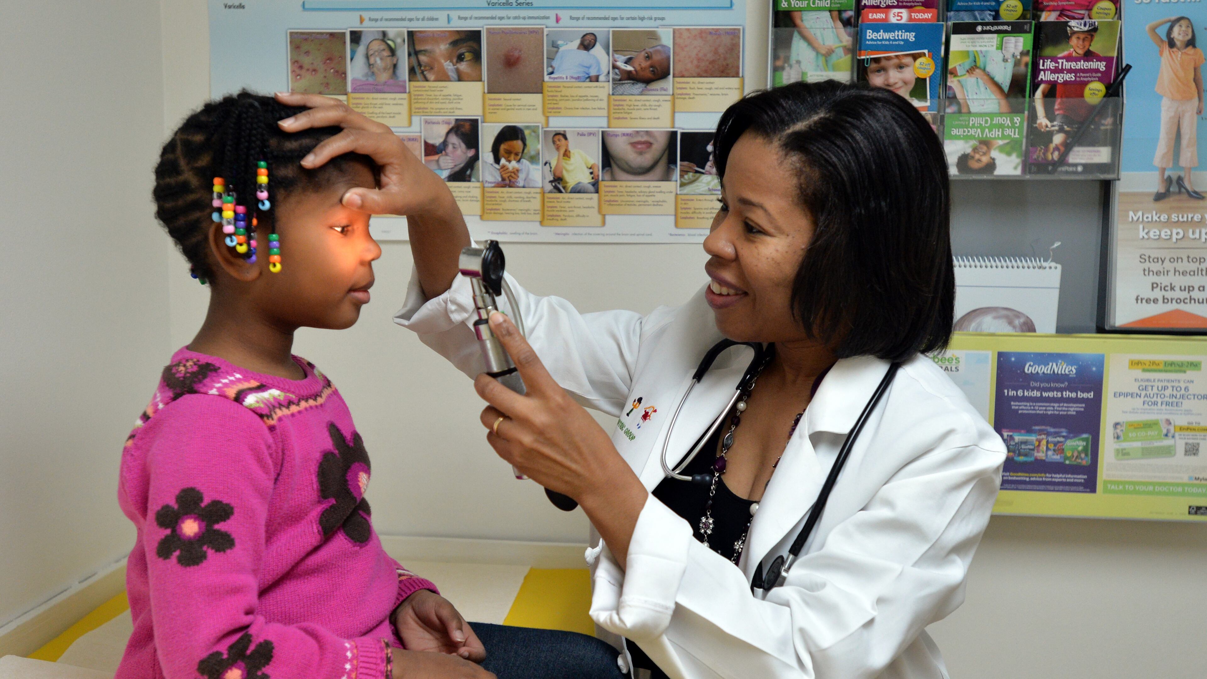 Dr. Melinda Willingham examines Kaiden Whisby, 5, at Decatur Pediatrics. BRANT SANDERLIN / BSANDERLIN@AJC.COM