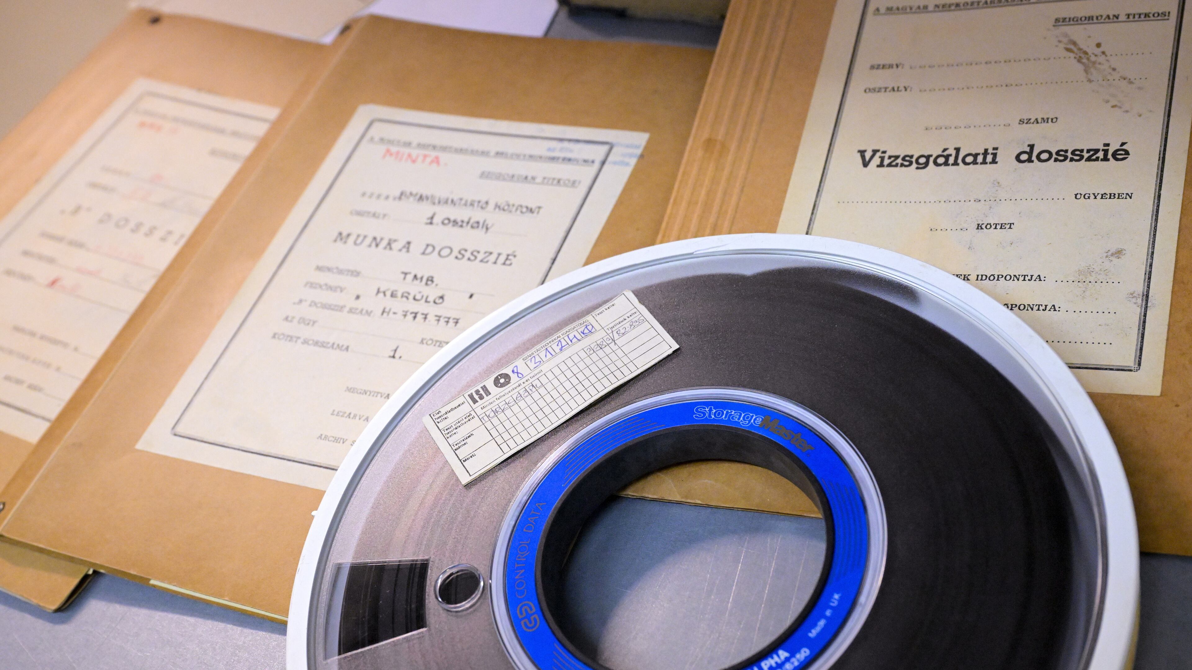 A magnetic tape for data storage and dossiers iare pictured in the Historical Archives of the Hungarian State Security Services (ABTL) in Budapest, Hungary, Tuesday, Sept. 29, 2026. (Zsolt Szigetvary /MTI via AP)
