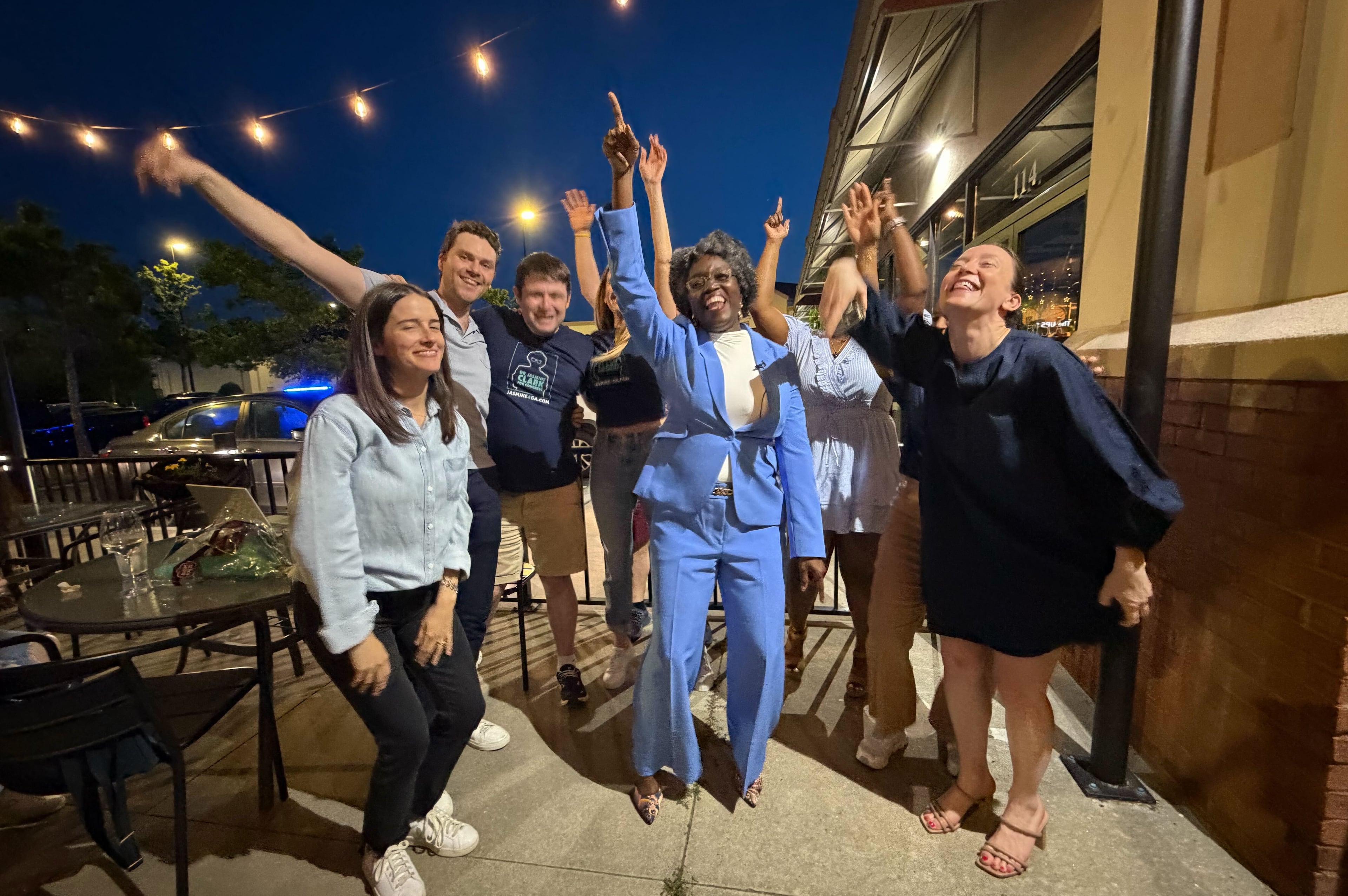 State Rep. Jasmine Clark and staff react to news that she is the likely winner on the Democratic ticket for U.S. House District 13 at her election night watch party at Fresca Trattoria in Stone Mountain on Tuesday, May 19, 2026. (Gavin Godfrey/AJC)