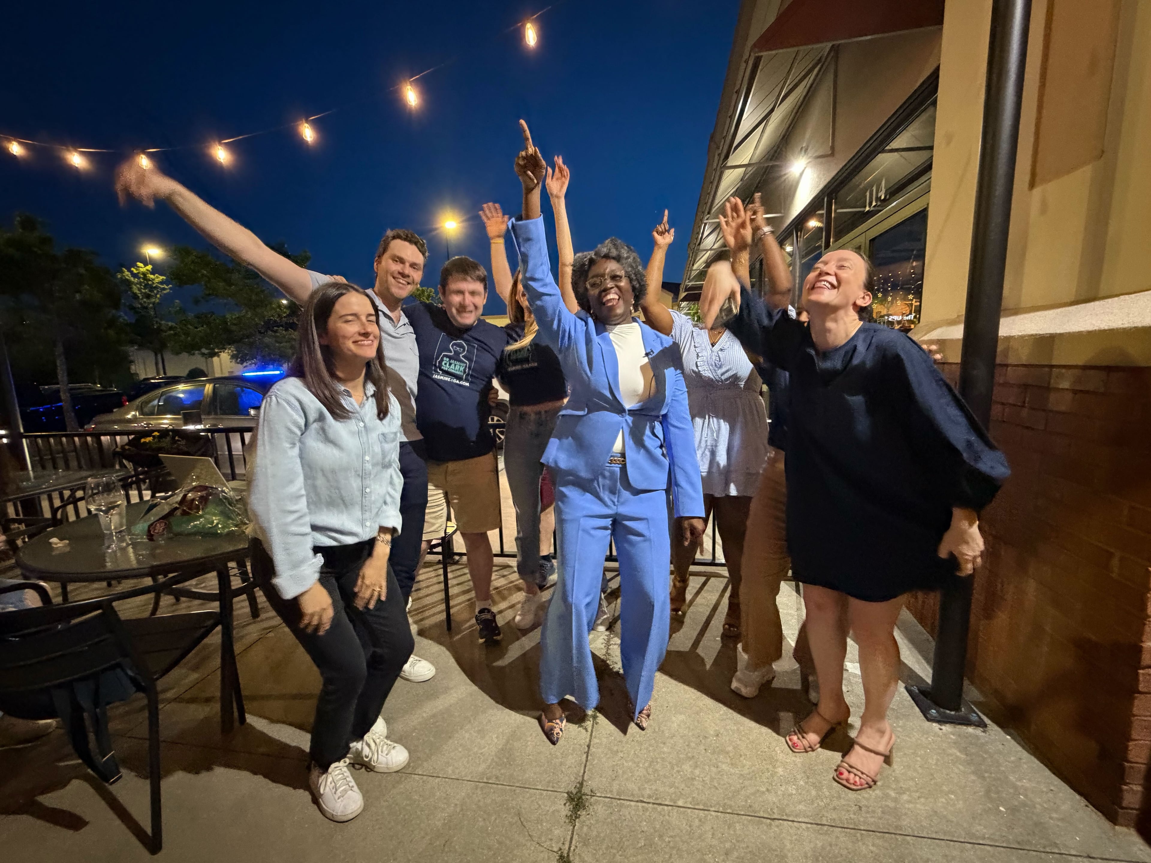 State Rep. Jasmine Clark and staff react to news that she is the likely winner on the Democratic ticket for U.S. House District 13 at her election night watch party at Fresca Trattoria in Stone Mountain on Tuesday, May 19, 2026. (Gavin Godfrey/AJC)