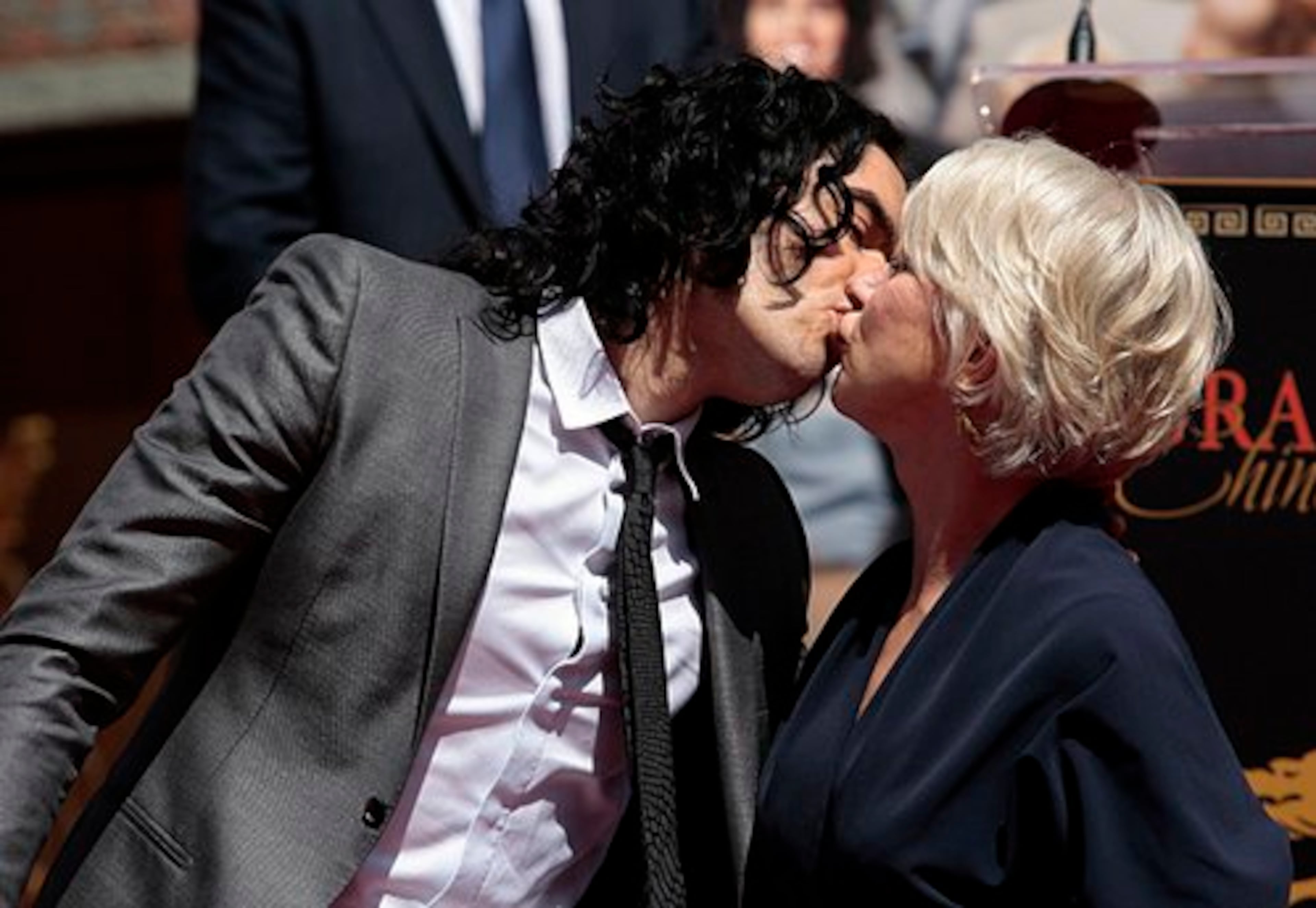 Actor Russell Brand kisses actress Helen Mirren after the ceremony. They appear together in the upcoming movie, "Arthur."