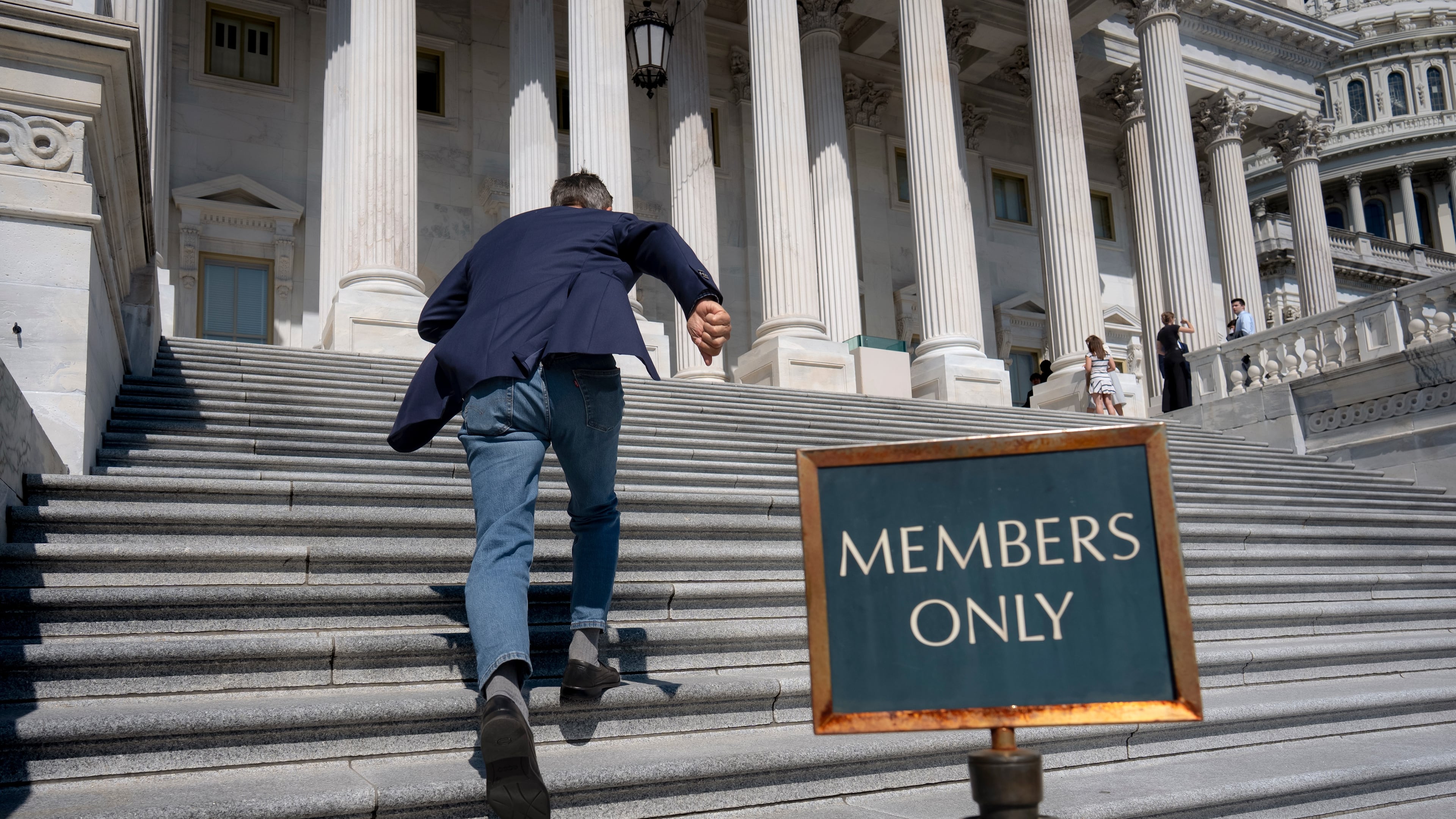Rep. Darrell Issa, R-Calif., rushes up the steps at the Capitol for final votes before the House of Representatives leaves for a five-week recess, in Washington, Thursday, July 23, 2026. (AP Photo/J. Scott Applewhite)