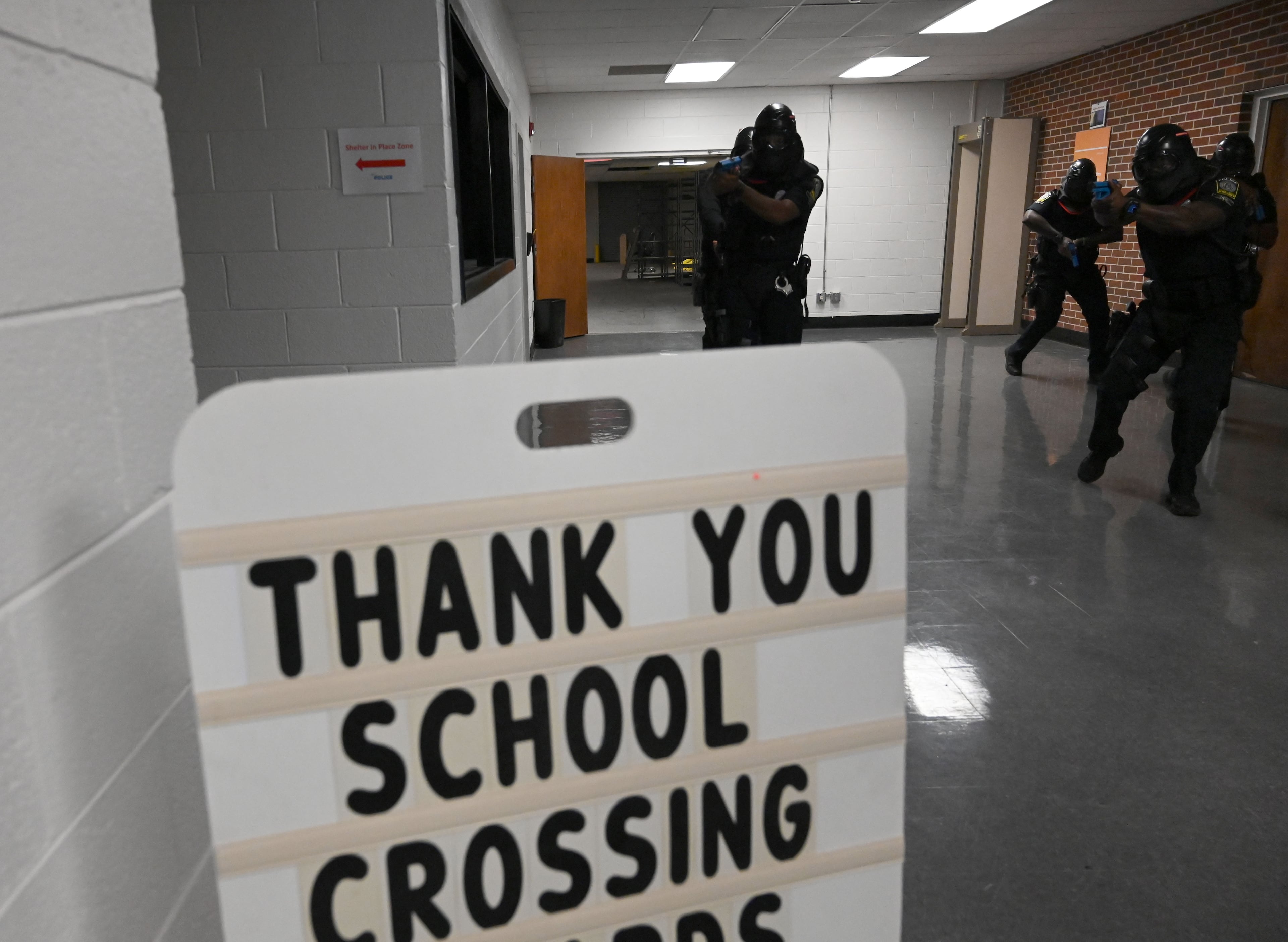Atlanta Public Schools’ new tactical team conducts a training scenario demonstration for members of the media at Atlanta Public Schools’ Brewer Training Center on Tuesday, July 21, 2026, in Atlanta. Atlanta Public Schools is adding two new units to its security apparatus to keep students and employees safe: a tactical team and a drone team. (Hyosub Shin/AJC)