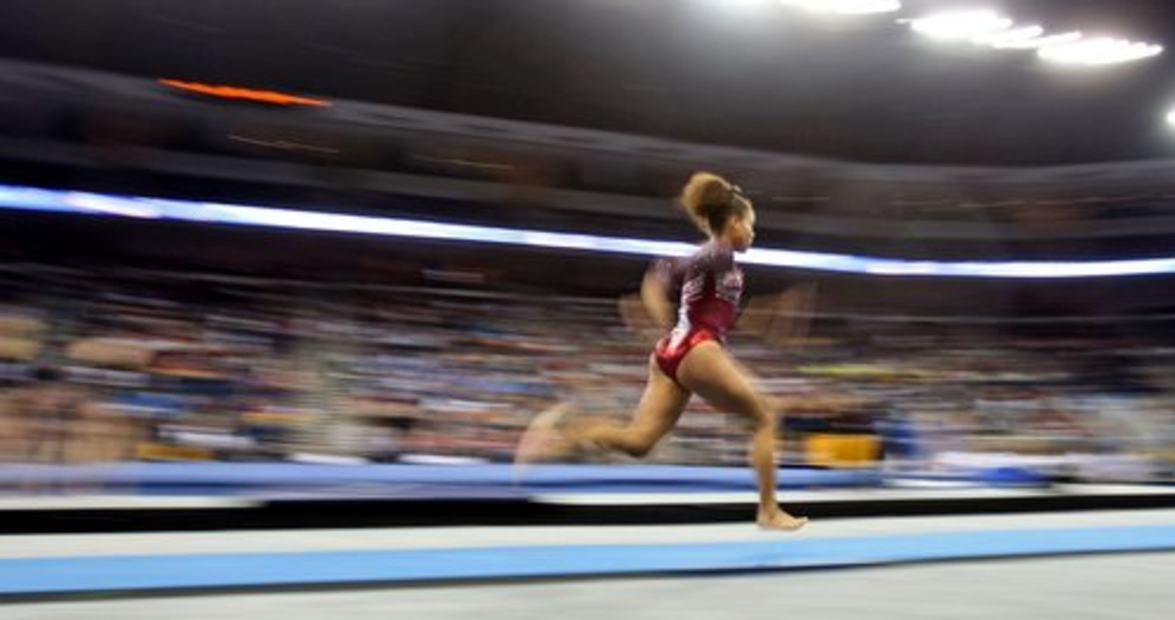 Alabama's Diandra Milliner runs as she practices before the start of the vault exercise.