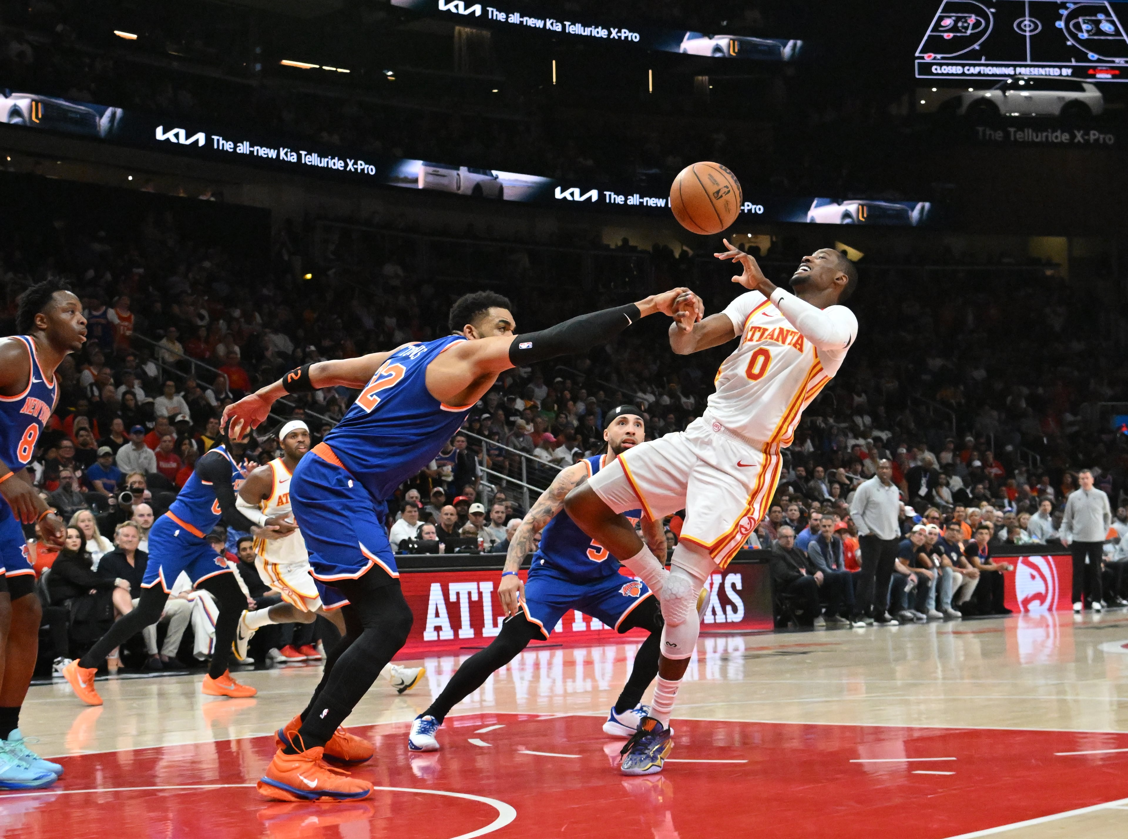 Knicks center Karl-Anthony Towns (left) knocks the ball away from Hawks forward Jonathan Kuminga on Thursday, April 30, 2026, in Atlanta. The Hawks’ season ended following an unfathomable 51-point loss to New York. (Hyosub Shin/AJC)