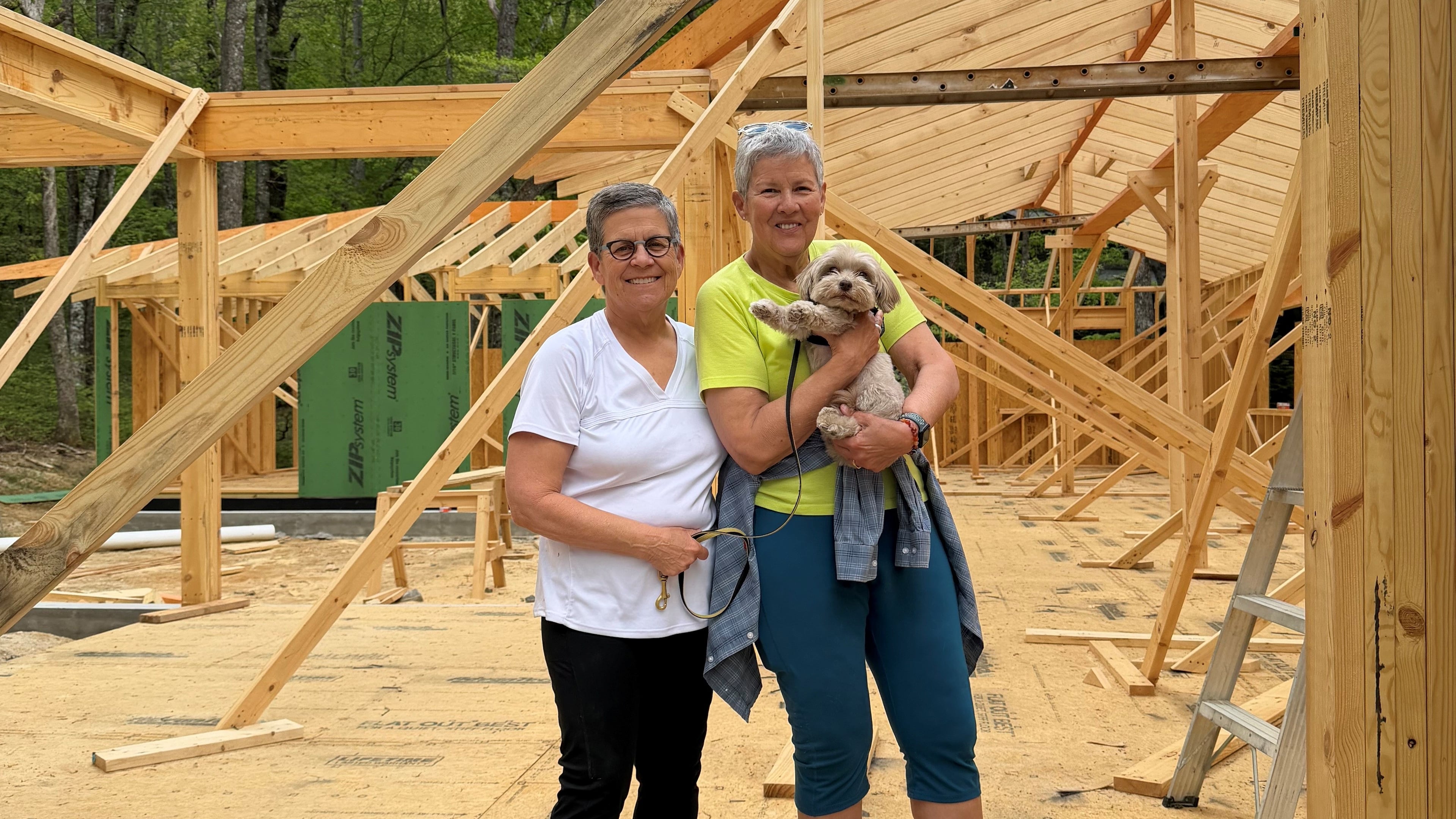 Cathy Woolard (left) and her wife, Karen Geney, pictured earlier this year at the site of the new home they are building in North Carolina. They are relocating from Atlanta after Woolard's decades in Atlanta politics and civic life. (Courtesy of Cathy Woolard)