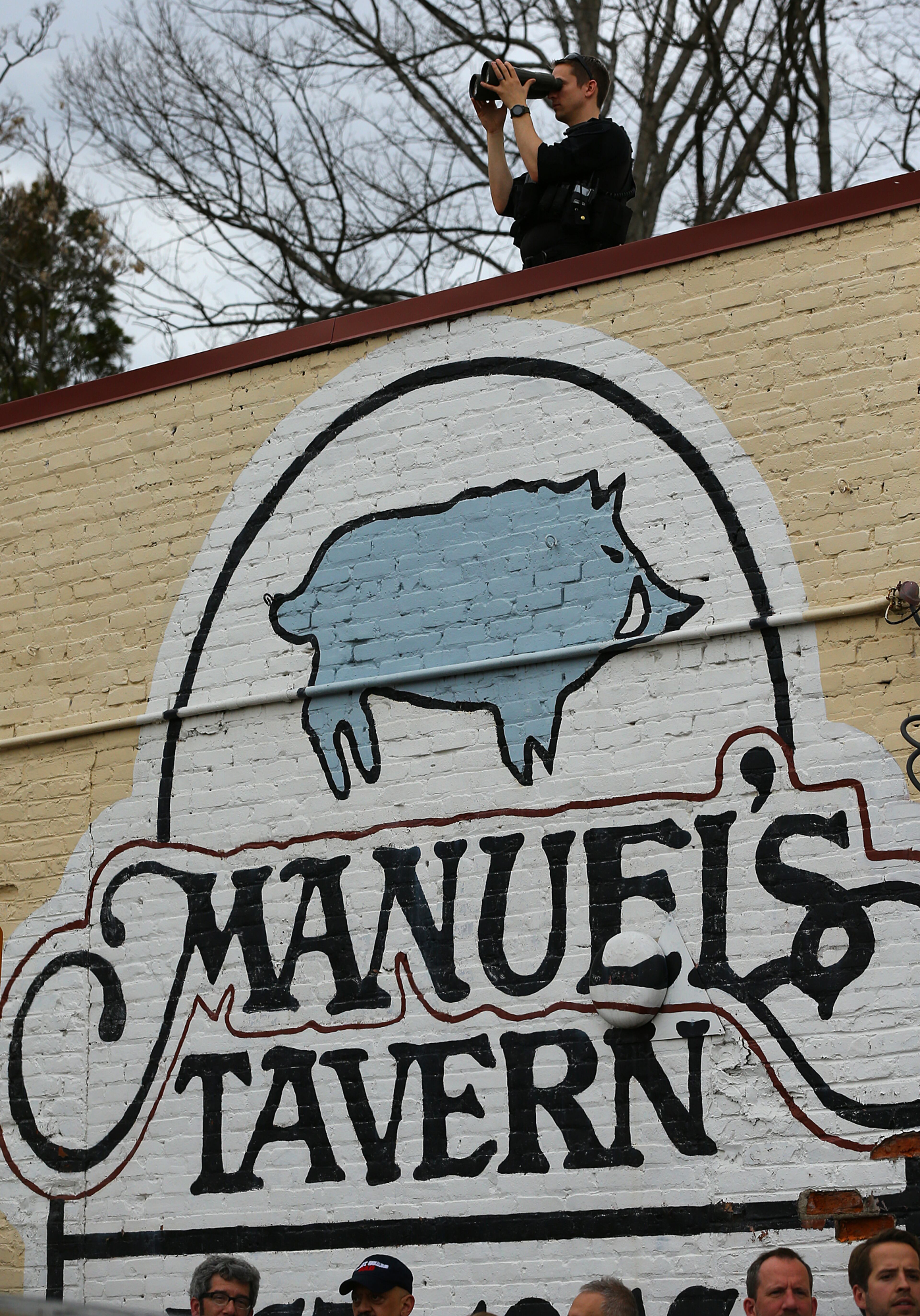Security keeps watch from the roof of Manuel's Tavern during a visit by President Barack Obama on Tuesday, March 10, 2015, in Atlanta. Curtis Compton / ccompton@ajc.com