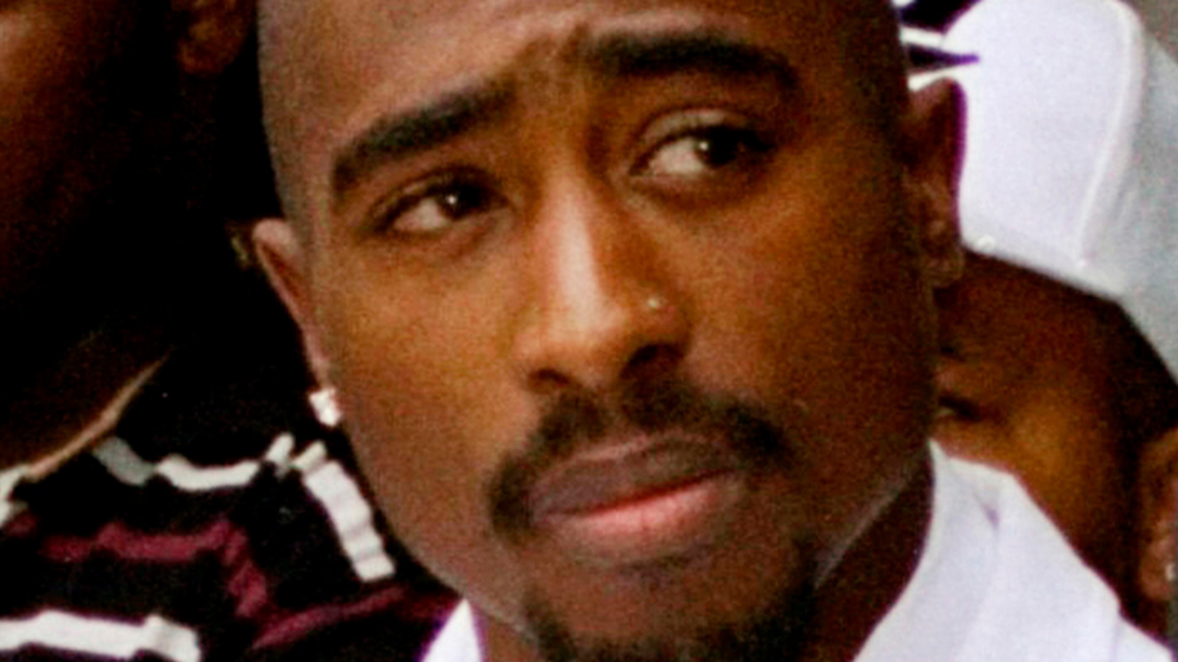 FILE - Rapper Tupac Shakur attends a voter registration event in South Central Los Angeles, Aug. 15, 1996. (AP Photo/Frank Wiese, File)