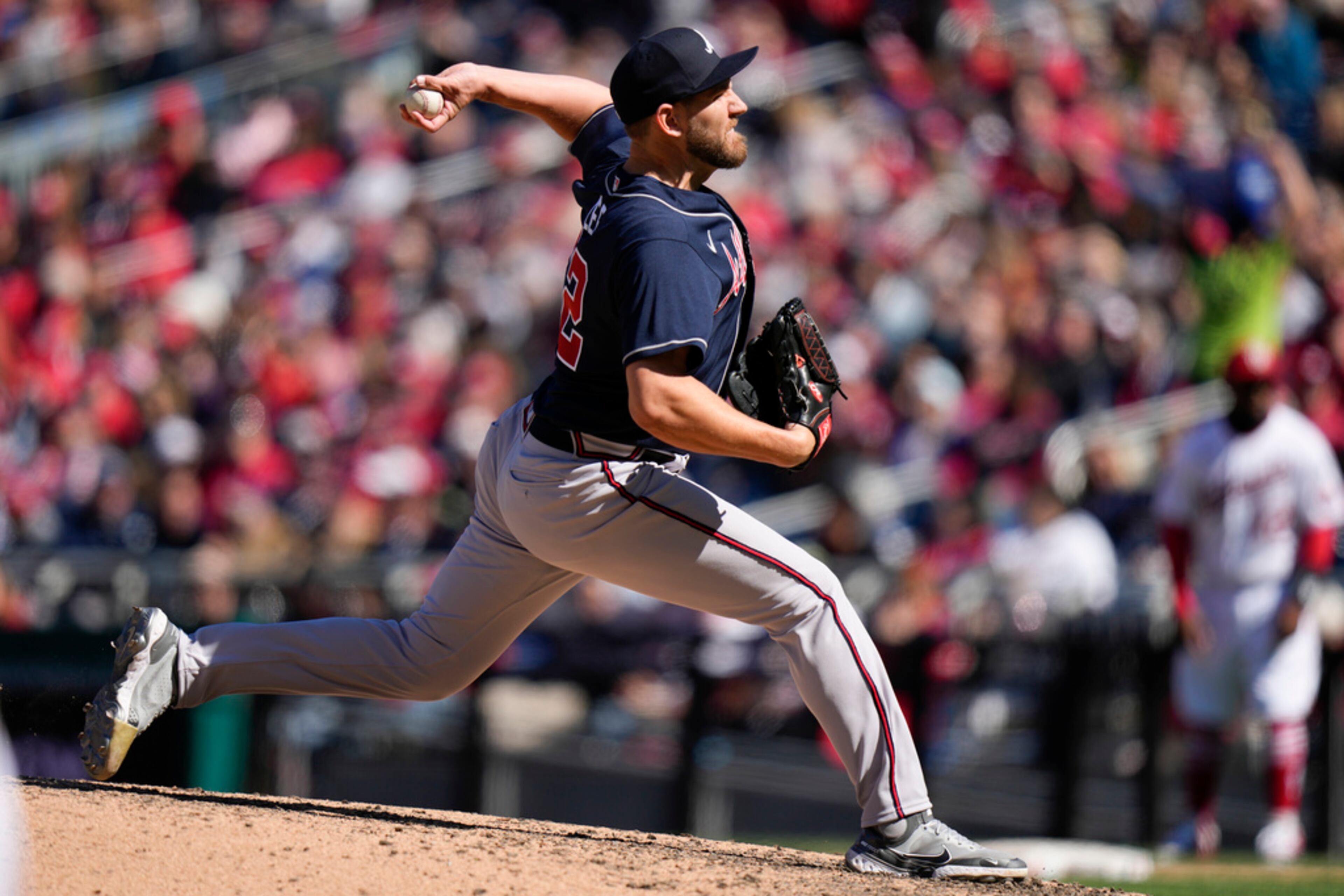 Atlanta Braves relief pitcher Dylan Lee throws to the Washington Nationals during the sixth inning of an opening day baseball game at Nationals Park, Thursday, March 30, 2023, in Washington. (AP Photo/Alex Brandon)